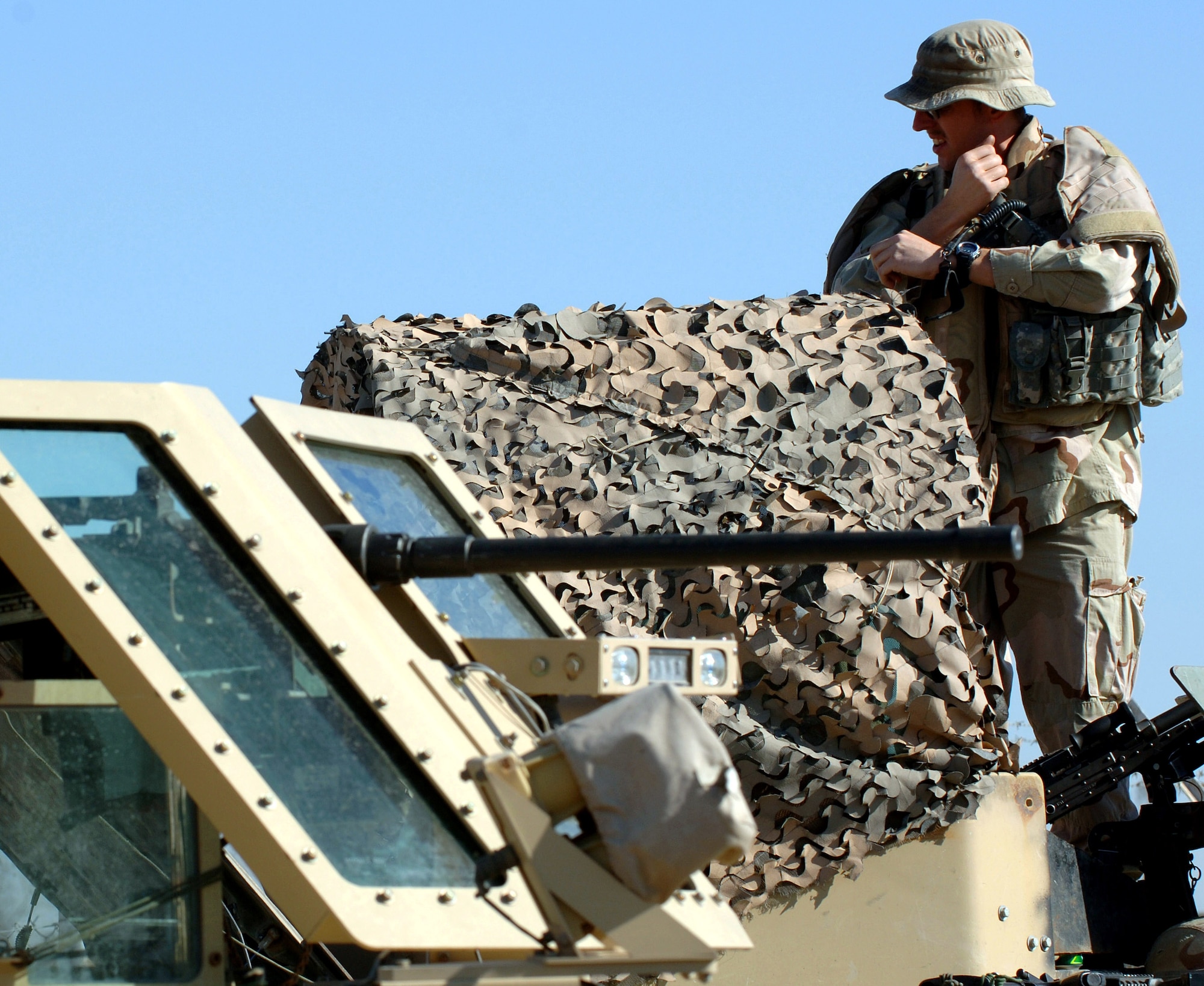 Staff Sgt. John Self adjusts his body armor before departing Camp Victory, Iraq, March 7. Sergeant Self, a security forces specialist deployed from the 314th Security Forces Squadron at Little Rock Air Force Base, Ark., was killed May 14 by a roadside bomb near Baghdad, Iraq. (U.S. Air Force photo/Staff Sgt. Michael R. Holzworth)
