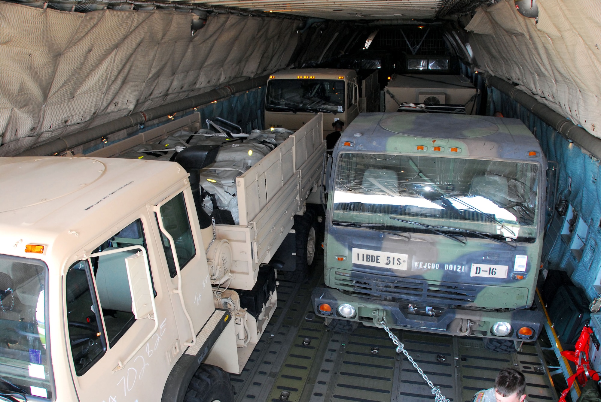 A C-5 Galaxy is loaded up with six Army vehicles at Hulman Field, Terre Haute, Ind., in support of Exercise Ardent Sentry on May 12, 2007. Ardent Sentry is designed to hone coordination between the Department of Defense as well as federal, state, local and private agencies in a series of challenging scenarios ranging from natural disasters to terrorist incidents. (U.S. Air Force photo/Senior Master Sgt. John S. Chapman)