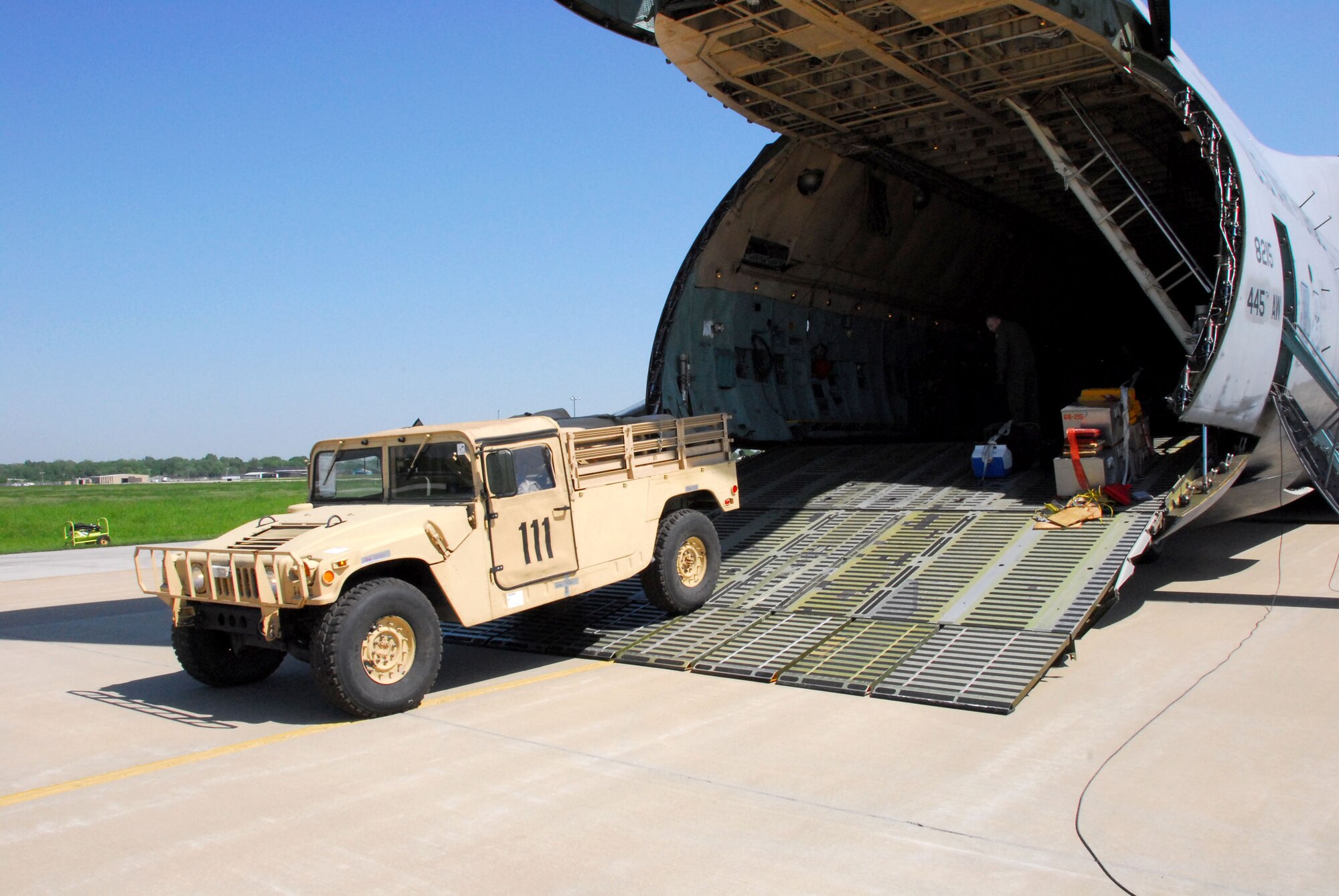 Army personnel off-load trucks May 12 from a C-5 Galaxy at Hulman Field in Terre Haute, Ind., in support of Exercise Ardent Sentry. Ardent Sentry is designed to hone coordination between the Department of Defense as well as federal, state, local and private agencies in a series of challenging scenarios ranging from natural disasters to terrorist incidents. (U.S. Air Force photo/Senior Master Sgt. John S. Chapman)
