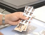 The new "Forever" postage stamp is now available at the post office on Lackland Air Force Base, Texas. The cost of mailing a standard letter, typically weighing in at 1 ounce, increased two cents, to 41 cents, on May 14. The Forever stamp, however, offers patrons an option to continually rising costs. The stamp is good for sending 1-ounce, first-class mail through the postal system anytime in the future, regardless of price changes. "If the price goes up again and you still have them, they're still good," assures Jessie Gonzalez from the Lackland post office. "Someone with a lot of mailing can really make out (with these stamps)." (USAF photo by April Blumer)                                