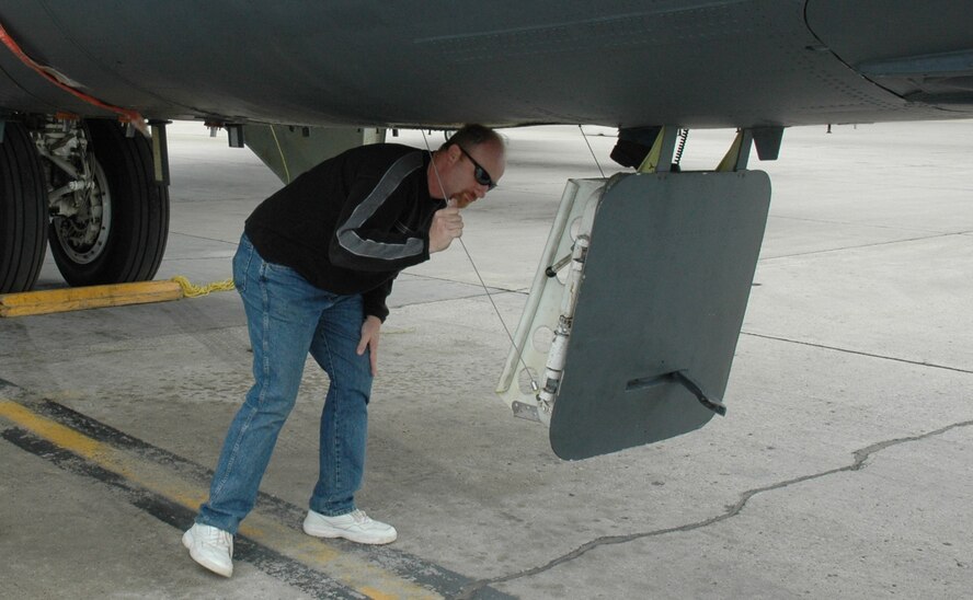 MINOT AIR FORCE BASE, N.D. -- Jason Cooper, an Air Force Palace Acquire Intern Program member, prepares to enter a B-52H Stratofortress during a tour here May 15. A group of interns from Tinker Air Force Base, Okla., visited the base to familiarize themselves with the B-52 because Tinker provides depot maintenance for the aircraft. The Palace Acquire program recruits people with management potential into careers as federal employees with a structured two-to-four-year training program. (U.S. Air Force photo by Stefan Bocchino)