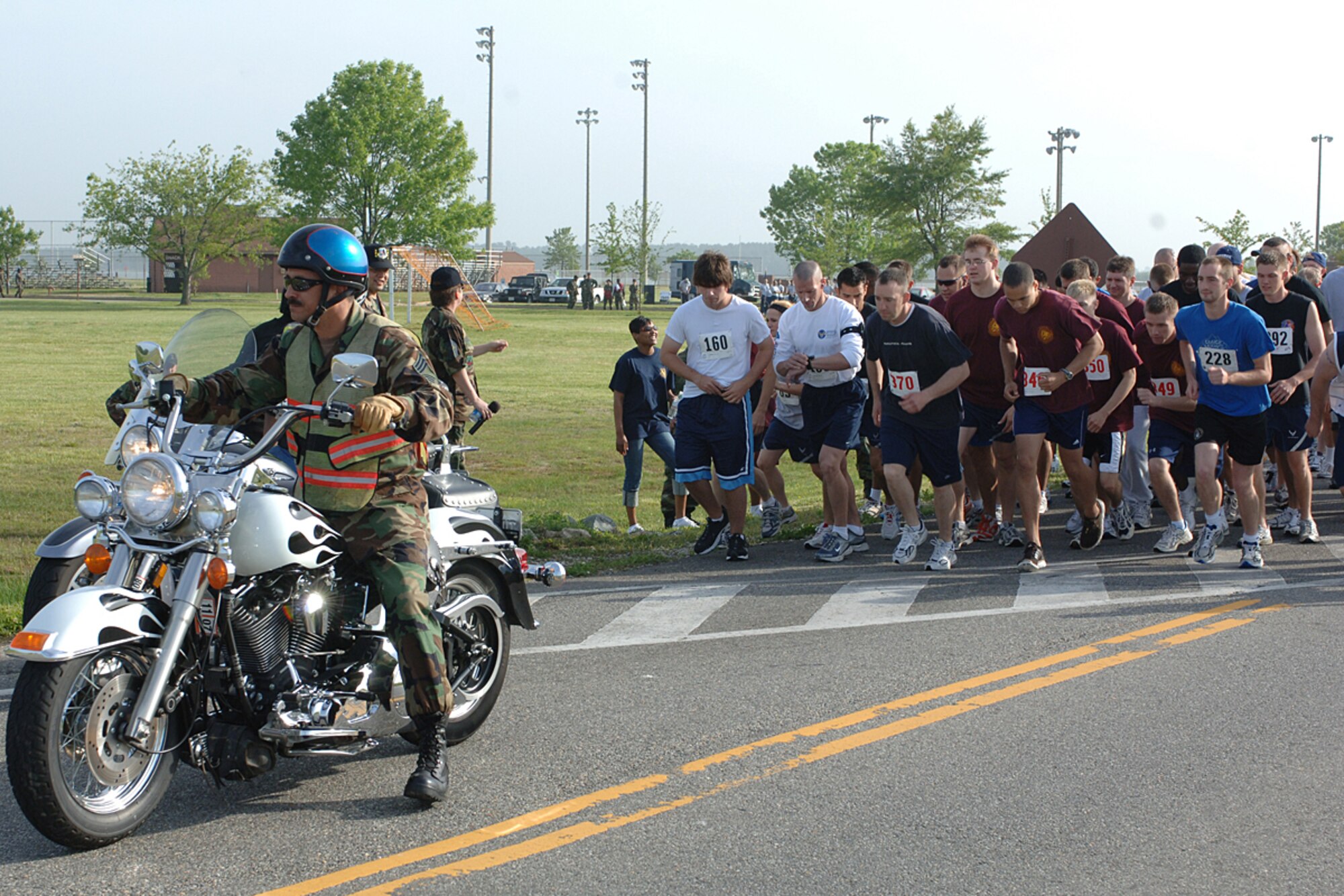 Chief Master Sgt. Michael Turcotte, 1st Maintenance Operations Squadron superintendent, leads the pack of participants during the Langley Chief’s Group 5K run/walk May 11. Almost 300 people participated in the event, raising an estimated $3,500 for base organizations including the Langley Airman and Family Support Center, Professional Development Center, graduations, promotions, award programs, honor guard events and the second annual Langley Junior Enlisted Appreciation Day, which is scheduled for June 8. (U.S. Air Force photo/Airman 1st Class Giang Nguyen)
