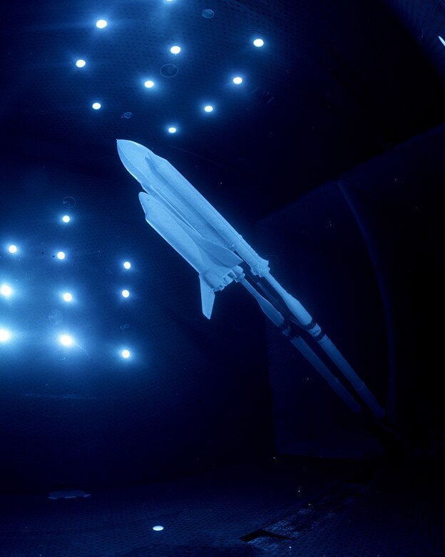 A “blue light” photo of the “full-stack” shuttle model in AEDC’s 16-foot transonic wind tunnel during model change in late 2004.