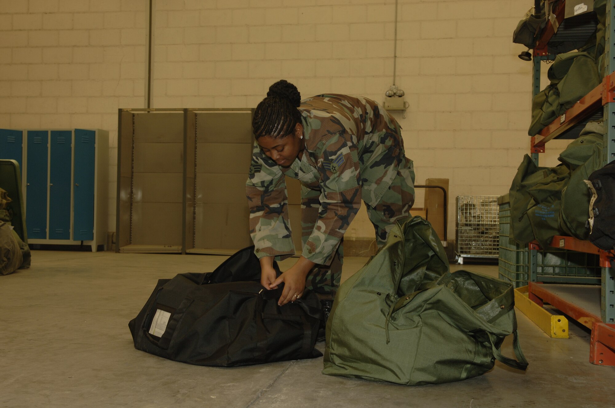 Senior Airman Priscilla Philidor, 39th Logistics Readiness Squadron mobility technician, checks to make sure the mobility bags have the proper gear on May 15.  The Mobility Bags program was one of the three practices nominated for best practices by the U.S. Air Forces in Europe Inspector General Team.  (U.S. Air Force photo by Airman 1st Class Kelly LeGuillon).