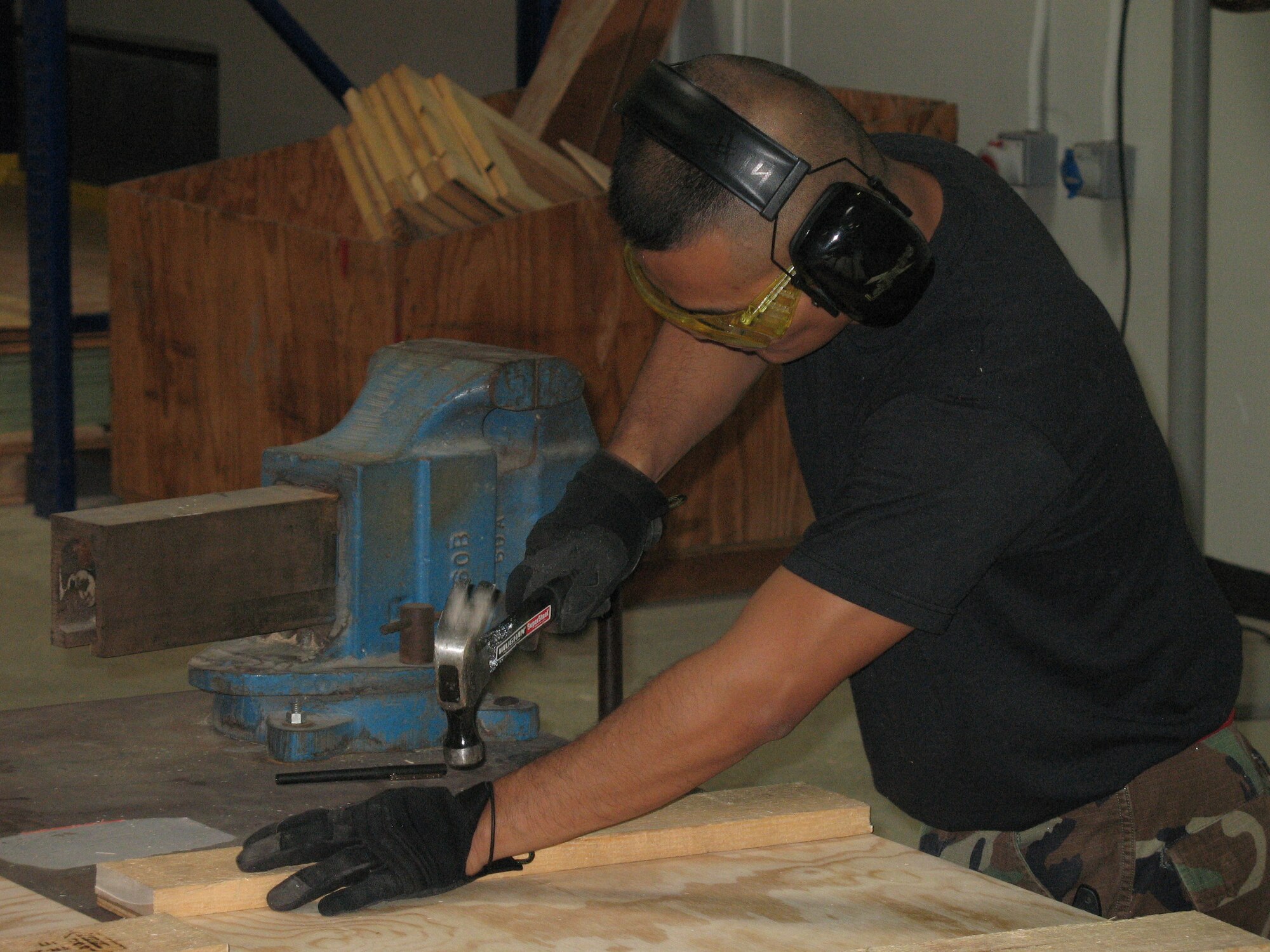 Staff Sgt. Ronnel Villodres builds a crate on May 9 for a C-17 Globemaster III brake being shipped out of Incirlik Air Base, Turkey.  The new crate fabrication process will save the Air Force money while getting Airmen the training they need to deploy.  (U.S. Air Force photo by Staff Sgt. Michael Jackson).
