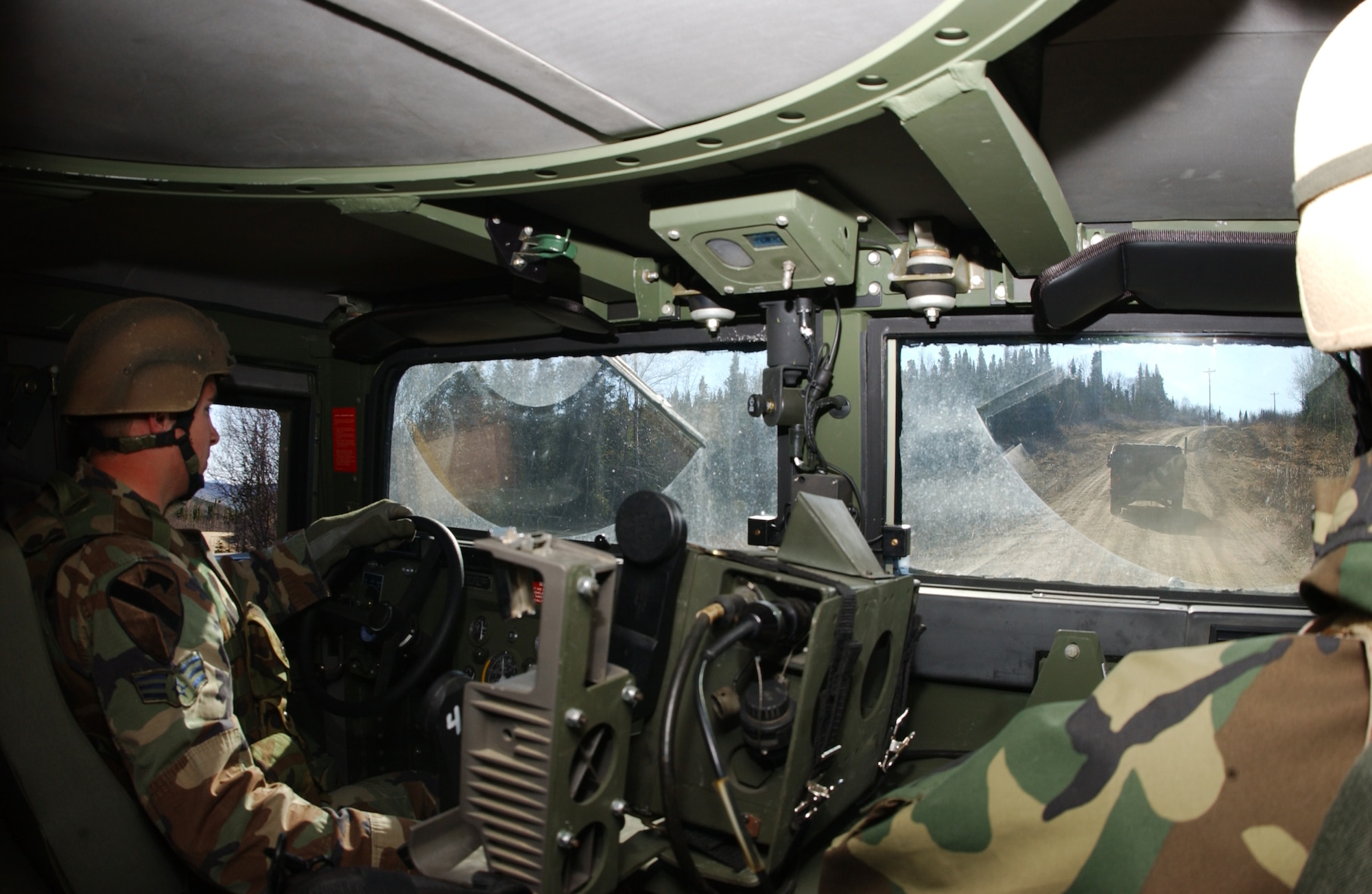 EIELSON AIR FORCE BASE, Alaska -- Senior Airman Robert Olson, 3rd Air Support Operations Squadron tactical air control party, drives a Humvee for a vehicle navigation exercise during Operation URSA Minor May 16 on the Pacific Alaska Range Complex. The 3rd ASOS, equips, and maintains mission-ready air liaison, terminal attack control, and weather observation/forecasting elements to support the U.S. Army Alaska 1st Stryker Brigade Combat Team. (U.S. Air Force Photo by Airman 1st Class Jonathan Snyder) 