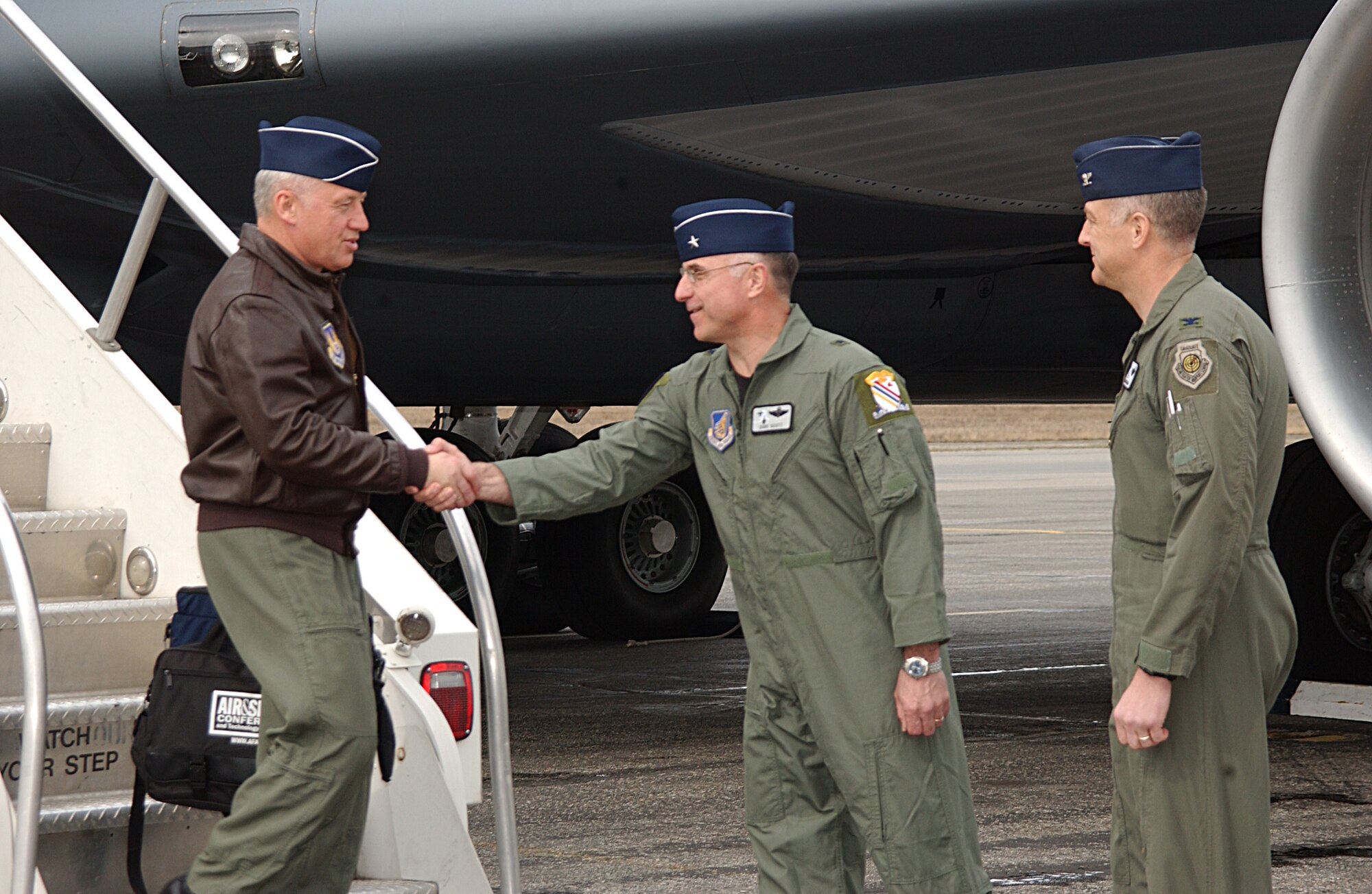 EIELSON AIR FORCE BASE, Alaska -- Gen. Bruce Carlson, Air Force Material Command commander, Wright-Patterson AFB, Ohio, is greeted by Brig. Gen. David Scott, 354th Fighter Wing commander May 13. This is General Carlson's first stop touring Pacific Air Forces to help gain base familiarization. (U.S. Air Force Photo by Airman 1st Class Jonathan Snyder) (Released)