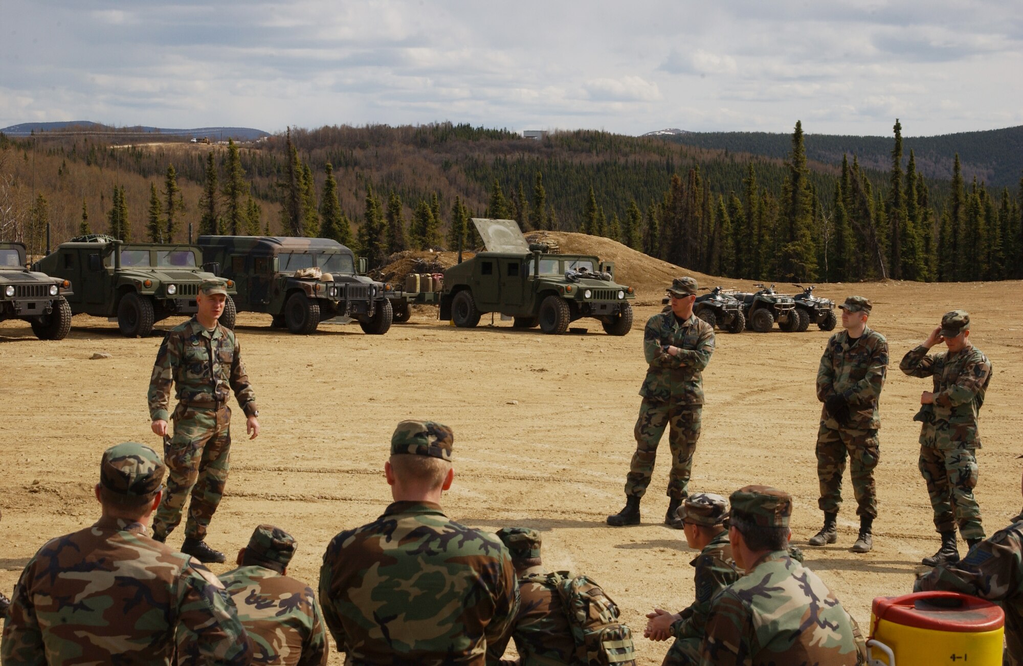 EIELSON AIR FORCE BASE, Alaska -- Tech. Sgt. Thomas Moody, 3rd Air Support Operations Squadron, briefs a class about combat techniques on Improvised Explosive Device Procedures, Defensive and Offensive Combat Procedures when dealing with a terrorist suspect on May 15 during Operation URSA Minor. ASOS members completed day one of a three-day field training exercise designed to prepare Airman with hands on combat training and experience before deploying to a combat area. (U.S. Air Force Photo by Airman 1st Class Jonathan Snyder) 