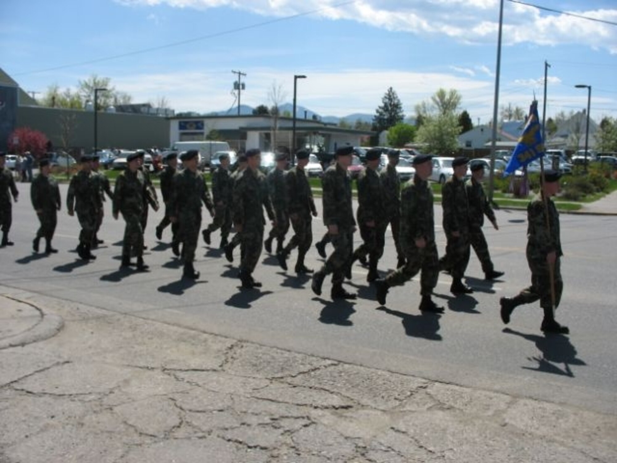24 members of the 341st Security Forces Squadron Alpha Flight march in a parade in Bozeman, Mont., May 12 to kick off Police Week activities.  (Courtesty photo)