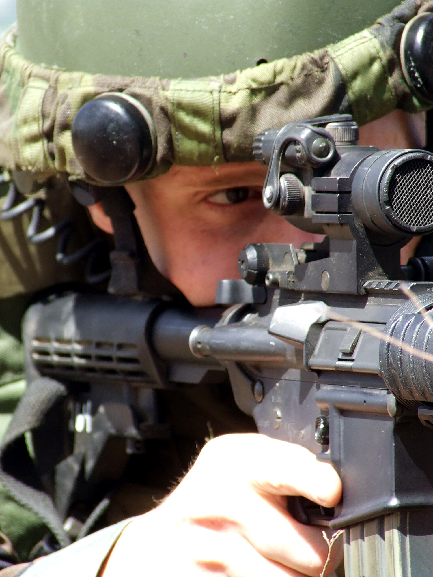 Staff Sgt. Joel Bane responds to a scenario during operations for Air Force Exercise Eagle Flag 07-4 April 21 at Naval Air Engineering Station Lakehurst, N.J. The exercise is operated by the U.S. Air Force Expeditionary Center's 421st Combat Training Squadron. Sergeant Bane is assigned to the 818th Contingency Response Group at McGuire Air Force Base, N.J. (U.S. Air Force photo/Tech. Sgt. Scott T. Sturkol) 