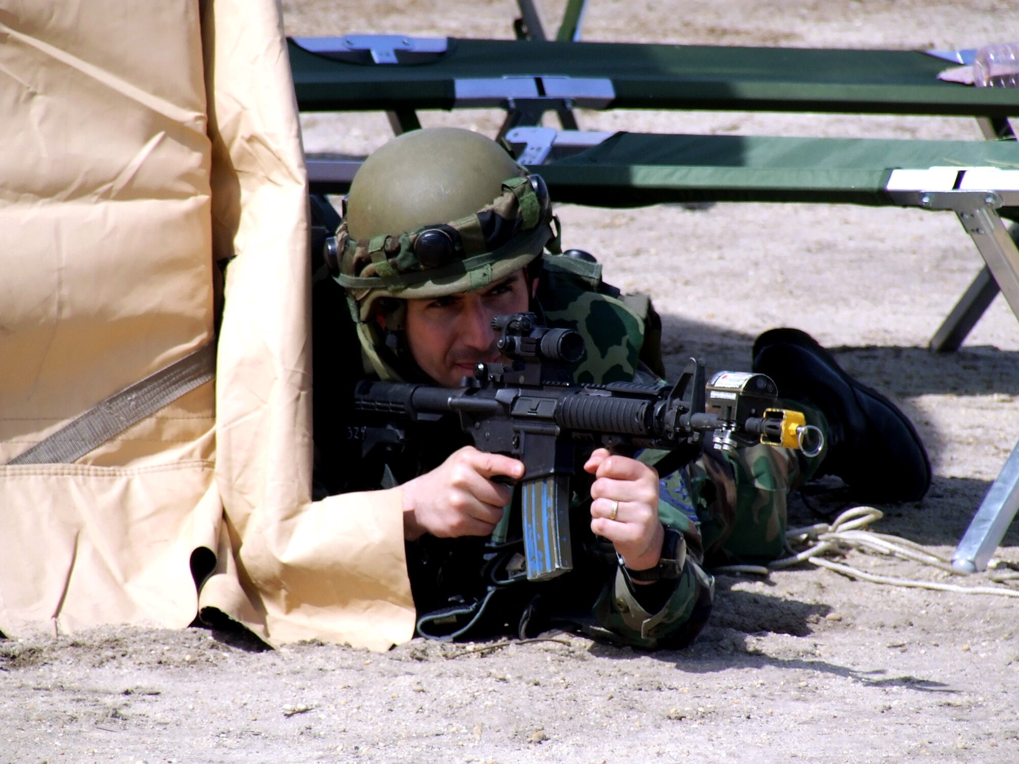 Senior Master Sgt. Randy Perrault responds to a scenario during operations for Air Force Exercise Eagle Flag 07-4 April 21 at Naval Air Engineering Station Lakehurst, N.J. The exercise is operated by the U.S. Air Force Expeditionary Center's 421st Combat Training Squadron. Sergeant Perrault is assigned to the 818th Contingency Response Group at McGuire Air Force Base, N.J. (U.S. Air Force photo/Tech. Sgt. Scott T. Sturkol)