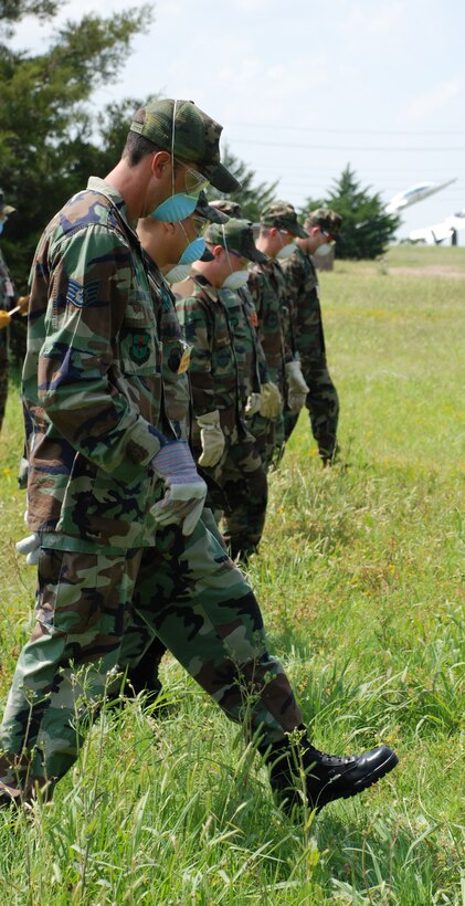 Sheppard search and recovery team members begin searching for remains during the major accident response exercise May 14. (U.S. Air Force photo/Airman 1st Class Jacob Corbin)