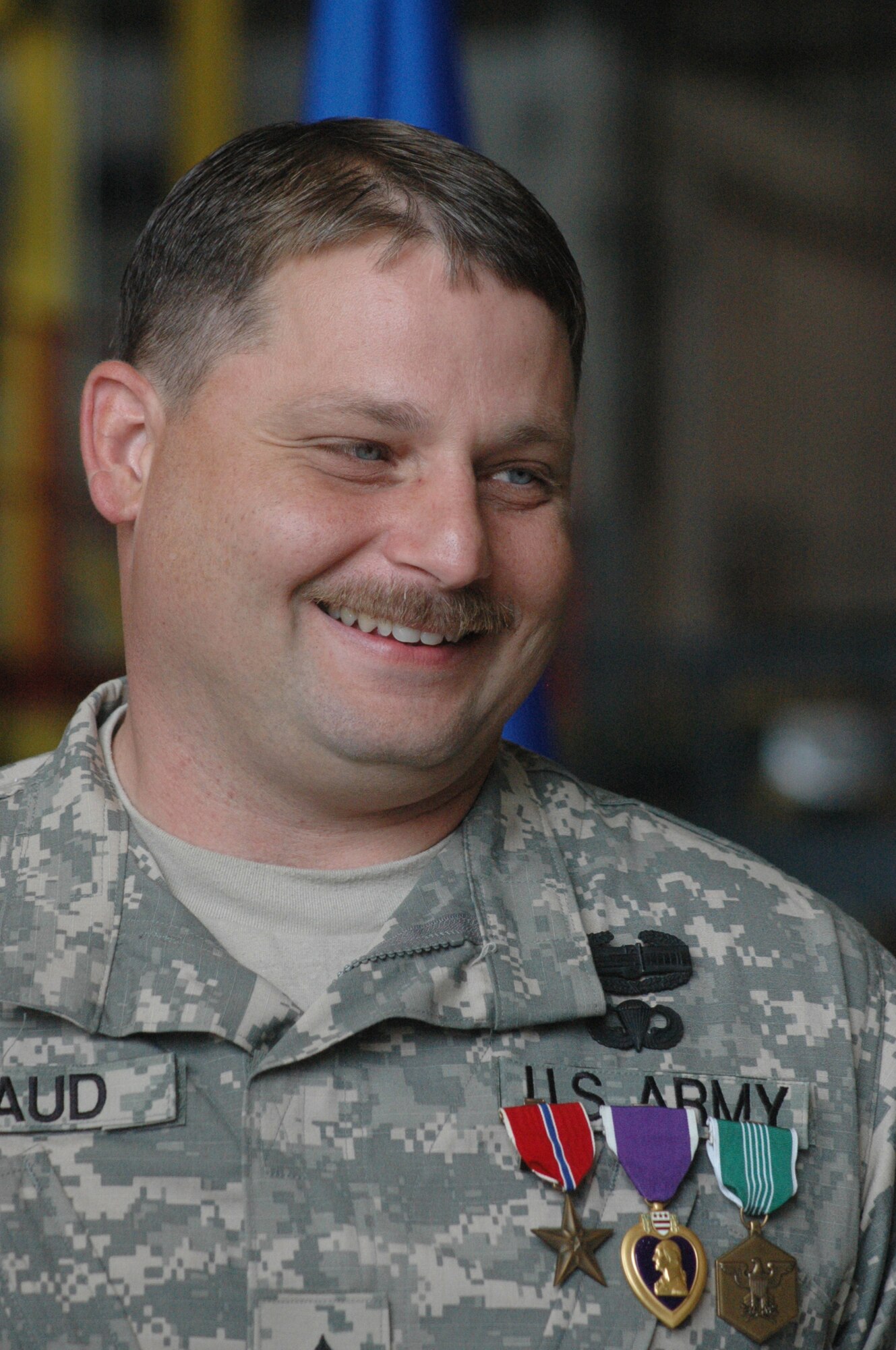 Bryan Braud, a painter in the 402 AMXG, F-15 shop, was a sergeant with the Georgia Army National Guard while deployed to Iraq when he earned the Bronze Star Medal, the Purple Heart & the Army Commendation Medal.  Col. Larry Dudney, Commander of the 48th Brigade presented Sgt. Braud his medals in the ceremony Monday. U.S. Air Force photo by Sue Sapp