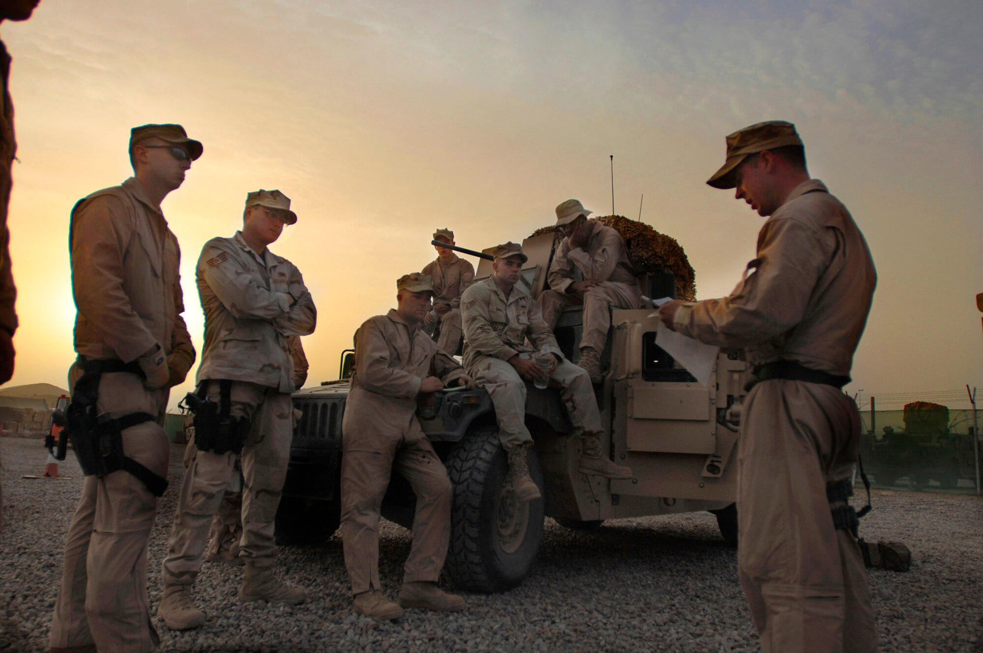 A team of security forces members gear up and conduct their morning brief on the day's events during their convoy to Iraqi police stations May 9 in Baghdad. Members of Det. 3, 732nd Expeditionary Security Forces Squadron, perform police transition teams mission of mentoring, coaching and teaching Iraqi police. (U.S. Air Force photo/Tech. Sgt. Cecilio M. Ricardo Jr.) 
