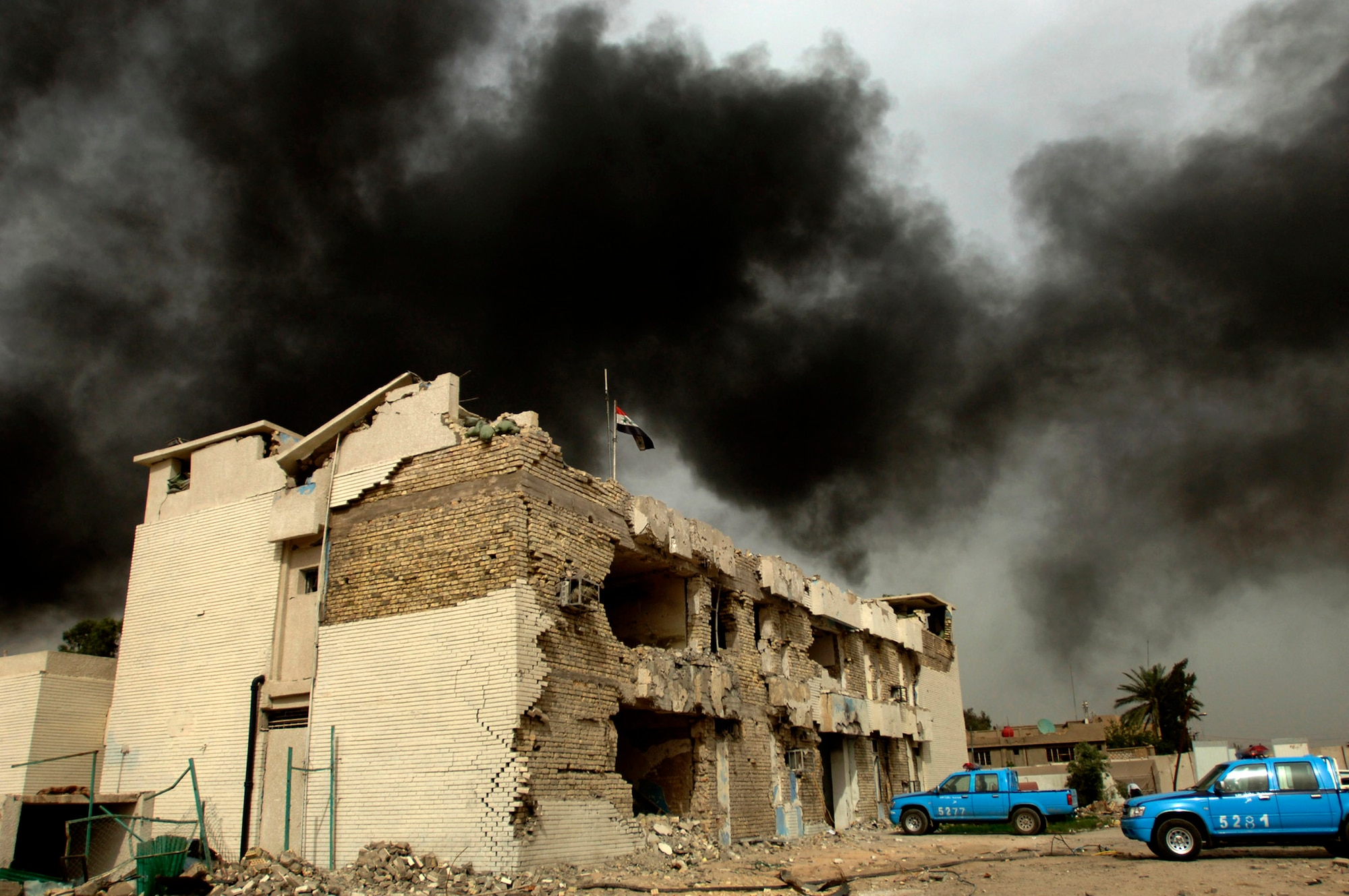Despite their station being bombed, Iraqi police continue working in the unharmed areas of the station and work the streets with the help of Det. 3 from the 732nd Expeditionary Security Forces Squadron May 9 in Baghdad. Members of the 732nd ESFS perform police transition team duties of mentoring, coaching and teaching Iraqi police. (U.S. Air Force photo/Tech. Sgt. Cecilio M. Ricardo Jr.) 
