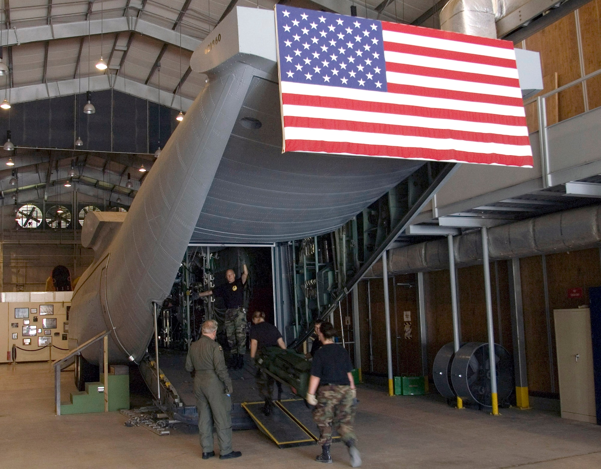 Students load "patients" into the C-130 Hercules simulator in the U.S. Air Force School of Aerospace Medicine at Brooks City-Base, Texas. The simulator provides a realistic platform for training students on fixed-wing aeromedical evacuation procedures. (U.S. Air Force photo/Steve Thurow)
