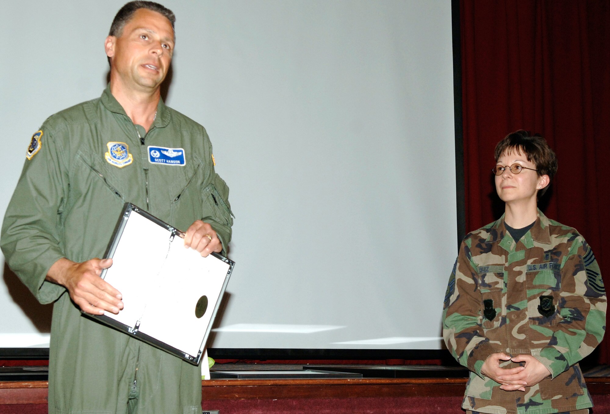 FAIRCHILD AIR FORCE BASE, Wash. – Col. Scott M. Hanson 92nd Air Refueling Wing commander, discusses the distinguished career and exemplary efforts of Chief Master Sgt. Judith Ruiz as she served as both chief of the 92d Medical Group and as interim command chief of the 92nd ARW. (U.S. Air Force photo/ Airman 1st Class Nancy Hooks)