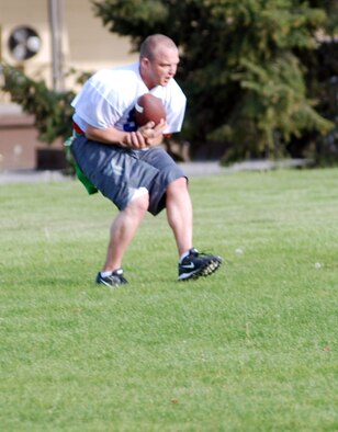 FAIRCHILD AIR FORCE BASE, Wash. -- Staff Sgt. Michael J. Mizer, 92nd Logistics Readiness Squadron fuels refueling maintenance supervisor, catches the winning touchdown during a scrimmage May 15. The 92nd LRS flag-football team finished second last year after going undefeated into the championship game. The team hopes to go undefeated into the championship game this year even with the loss of two key players from last year’s second-place team (U.S. Air Force Photo/Tech. Sgt. Larry Carpenter)