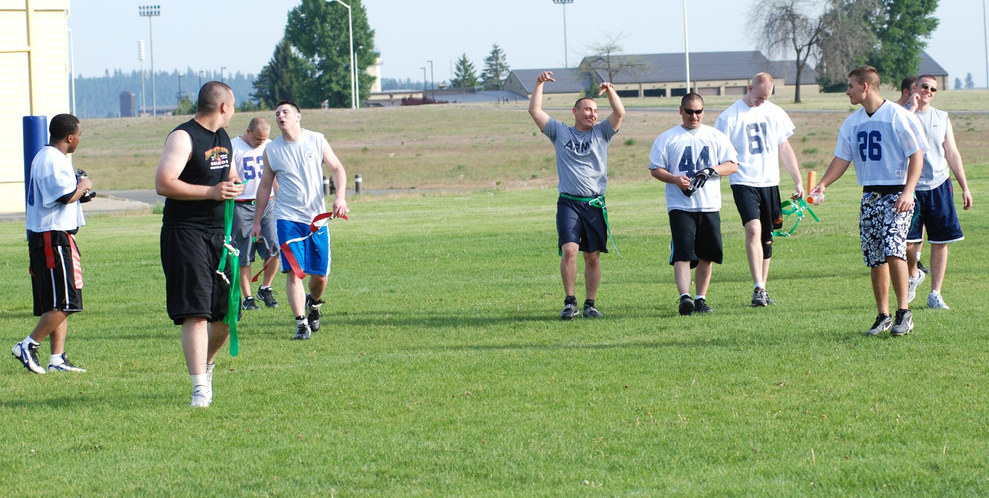 FAIRCHILD AIR FORCE BASE, Wash. -- Teammates from the 92nd Logistics Readiness Squadron flag-football team head back to the sideline after a scrimmage.  The team was practicing for an upcoming game to make sure their undefeated record stays intact. (U.S. Air Force Photo/Tech. Sgt. Larry Carpenter)