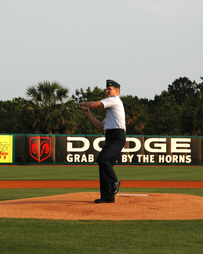 Col. Tim Wrighton, commander of the 315th Airlift Wing at Charleston AFB, S.C., throws out the first pitch at the River Dogs' military appreciation night. (Photo by Capt. Wayne Capps, USAFR)