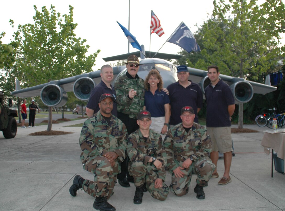 Members of Charleston AFB's Mini C-17 Team and members of Team Charleston's Explosive Ordnance Disposal Team pose for a picture with Sergeant Slaughter, WWE Wrestling Superstar at the River Dogs military appreciation night. (Photo by Capt. Wayne Capps, USAFR)