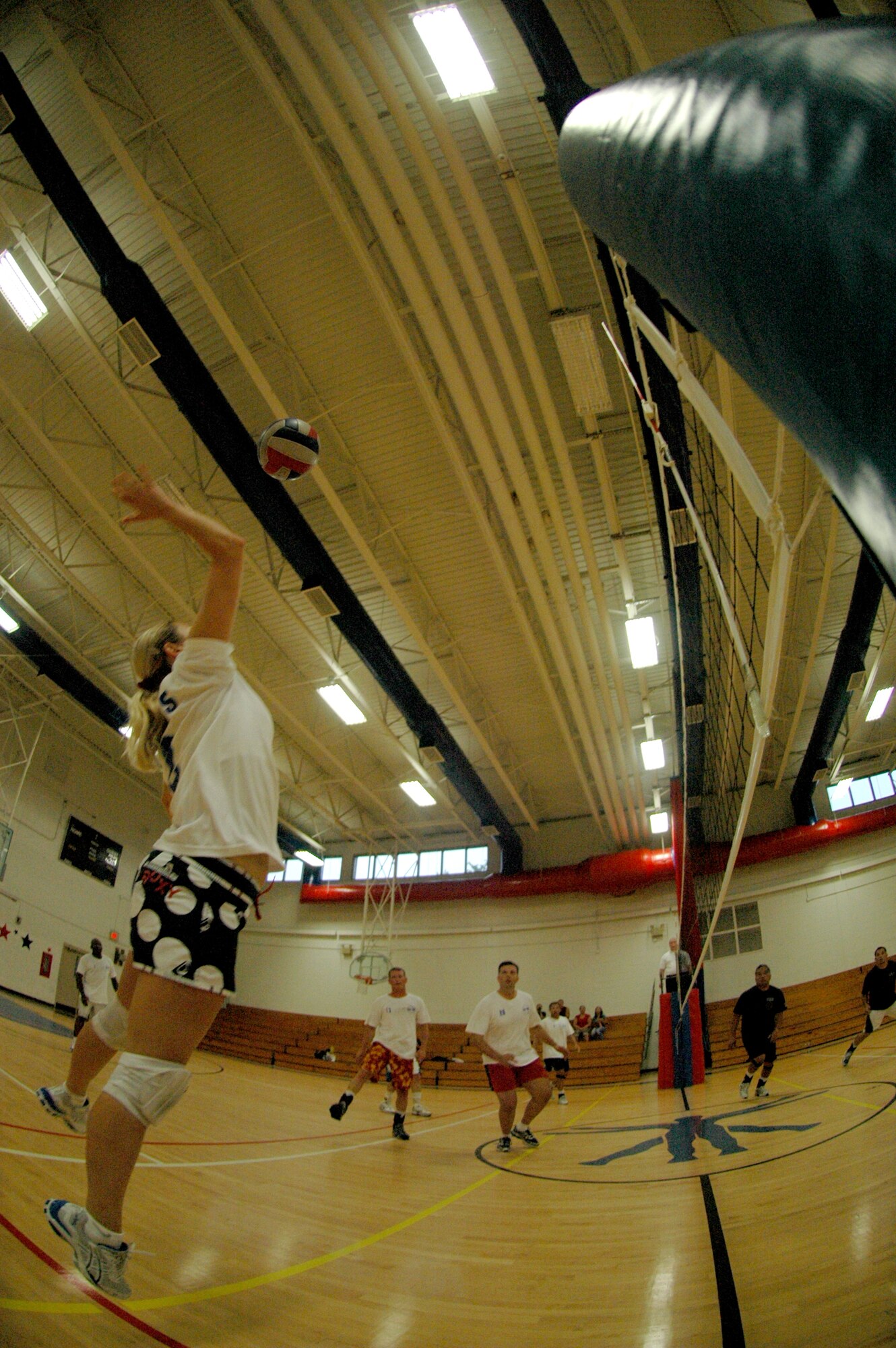 EGLIN AIR FORCE BASE, Fla. -- Knichole Miller, 33rd Fighter Wing, recovers a pass and sends it back over the net to the 96th Civil Engineer Group during the intramural volleyball championships here May 16. The 33rd FW doubly eliminated the 96th in a best-of-three match game, 19-25, 25-18 and 15-7 to win their third intramural volleyball championship in a row. Miller was named most valuable player for her prowess as a defensive and passing specialist. (U.S. Air Force photo by Staff Sgt. Mike Meares)