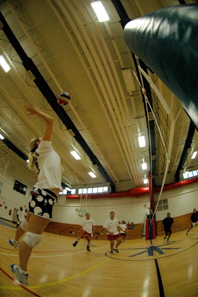 EGLIN AIR FORCE BASE, Fla. -- Knichole Miller, 33rd Fighter Wing, recovers a pass and sends it back over the net to the 96th Civil Engineer Group during the intramural volleyball championships here May 16. The 33rd FW doubly eliminated the 96th in a best-of-three match game, 19-25, 25-18 and 15-7 to win their third intramural volleyball championship in a row. Miller was named most valuable player for her prowess as a defensive and passing specialist. (U.S. Air Force photo by Staff Sgt. Mike Meares)