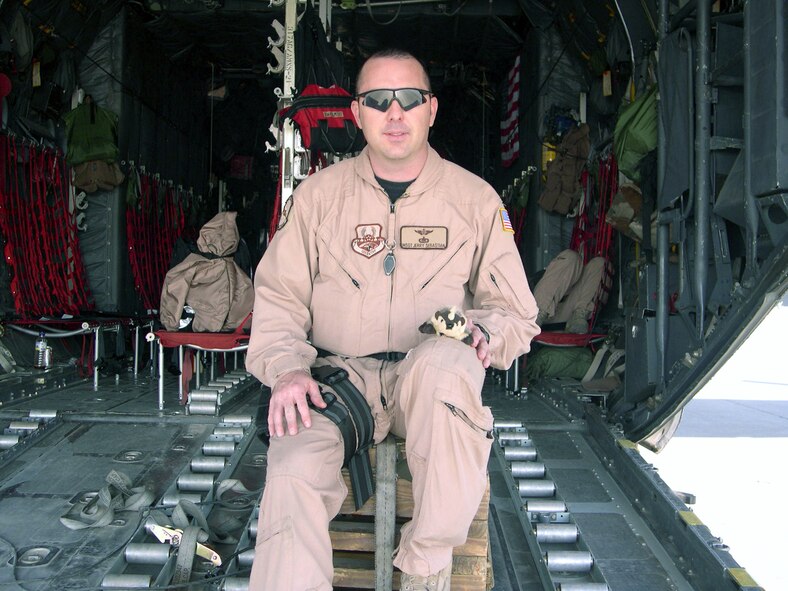 Master Sgt. Jerry Sebastian, a 40th Airlift Squadron C-130 crew member deployed with the 746th Expeditionary Airlift Squadron, poses for a photo with a stuffed badger from the students of Merkel Elementary, who he and other 40th AS members visited before they deployed. The children were so inspired by Dyess Airmen that they responded with gifts and patriotic sentiment May 15. (Photo provided by Col. Michael Zick, 746th EAS commander)