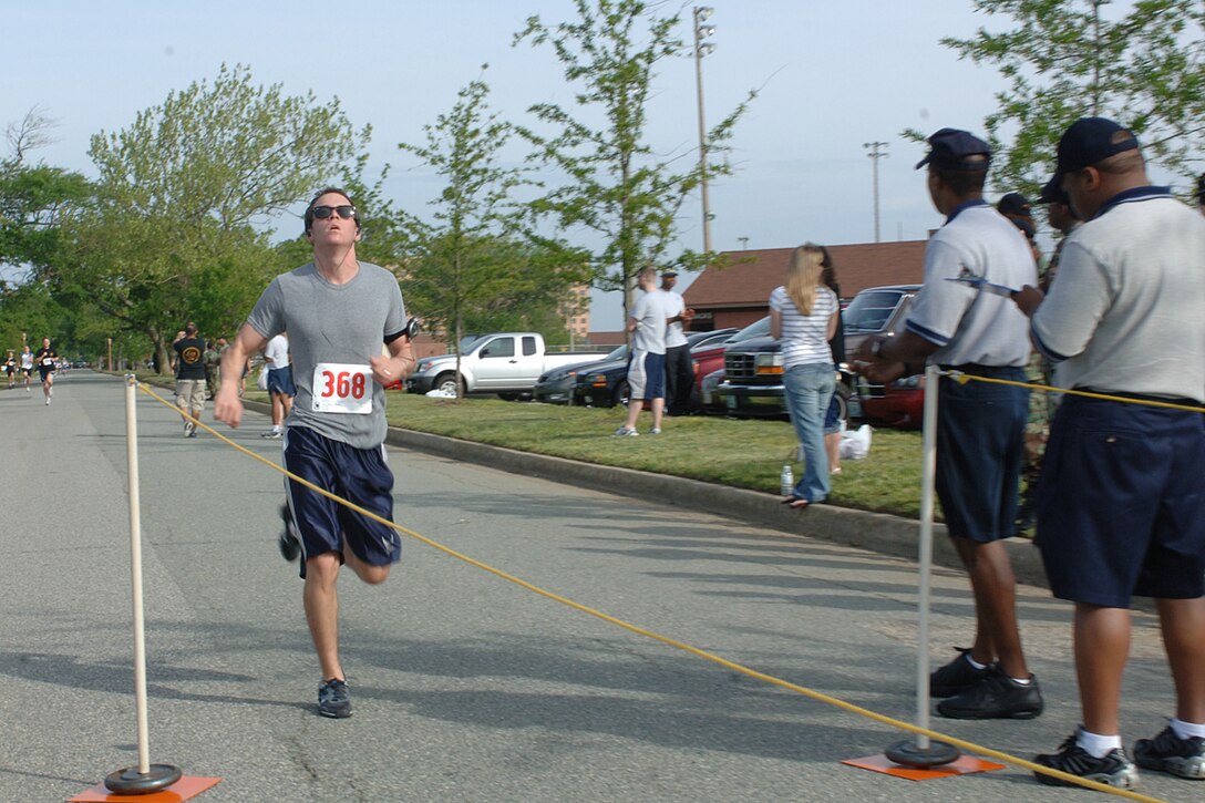 Senior Airman Knox, from the First Communication Squadron, runs toward the finish line at the 5k run on May 11, 2007 at Little League Field Across from Enlisted Club, Langley AFB, VA.  The 5K run/walk is encouraging Air Force members to participate in order to raise fun and promote physical fitness. (U.S. Air Force photo by A1C Nguyen
