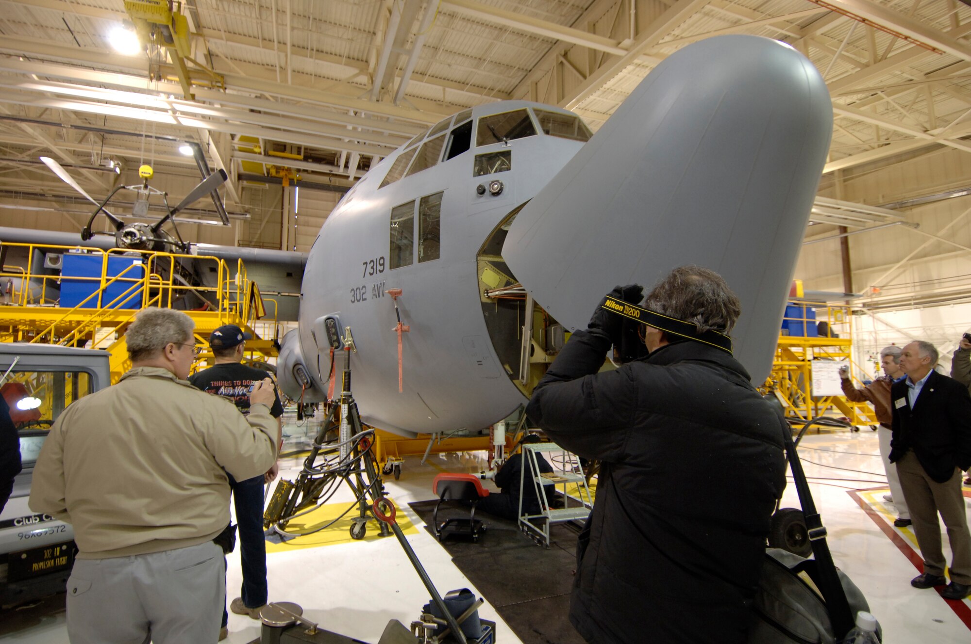 Michigan civic leaders hosted by the 927th Air Refueling Wing (Air Force Reserve Command) witness a C-130 Hercules undergoing an isochronical inspection at the 302nd Airlift Wing, Peterson AFB, Colorado. Like inspections are conducted on KC-135 aircraft in the air refueling wing's hangar at Selfridge Air National Guard Base, Mich.