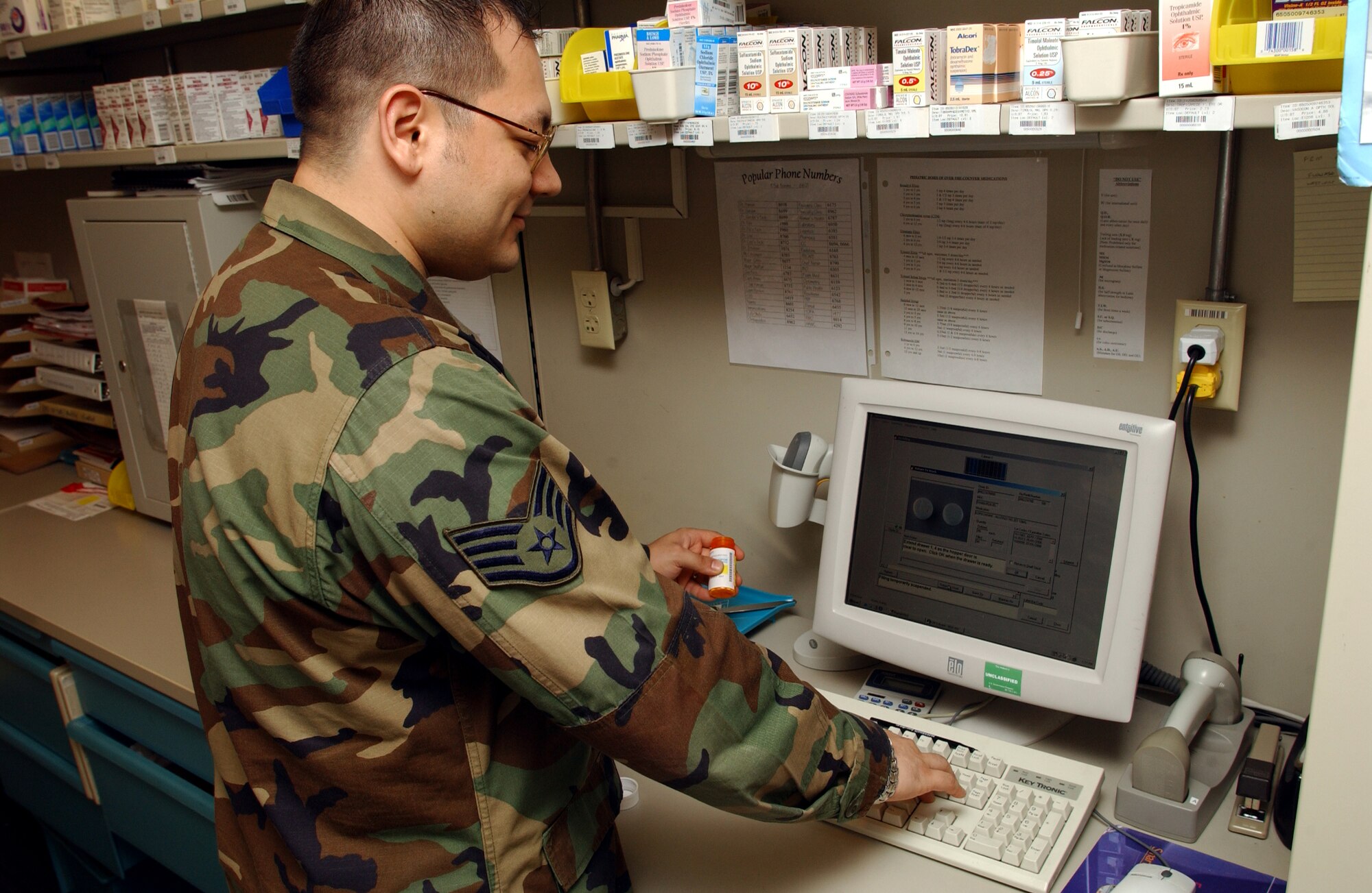 Staff Sergeant Joe Painatongo 39th Medical Group fills a prescription for a waiting patient at incirlik's pharmacy 17 May. Prescription medication is critical to the well being of all Incirlik members are filled quickly, and above all, accurately. (U.S. Air Force photo by Airman First Class Timothy A. Taylor)