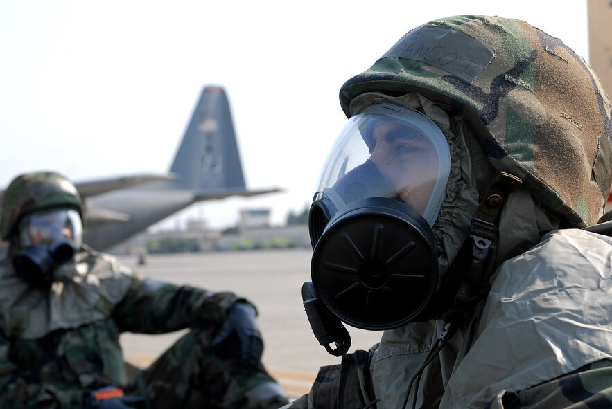 Staff Sargeant John Franco II, of the 374th Aircraft Maintenance Squadron, waits for the all clear from the simulated attack during Beverly Morning 07-05. Beverly Morning is an exercise that tests and trains Airmen in war time scenarios.(U.S. Air Force photo by Airmen 1st Class John M. Albea VIRIN )