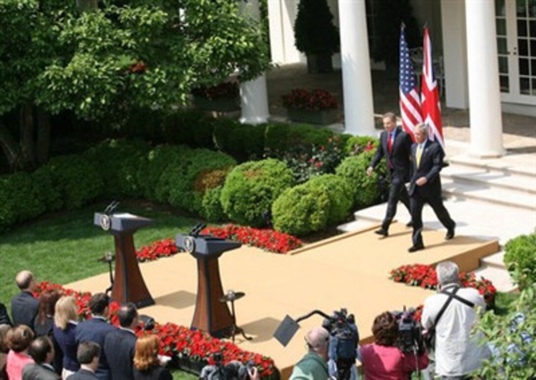 President George W. Bush and Prime Minister Tony Blair of the United Kingdom, walk to the podiums May 17, 2007, to begin their joint press availability in the Rose Garden.