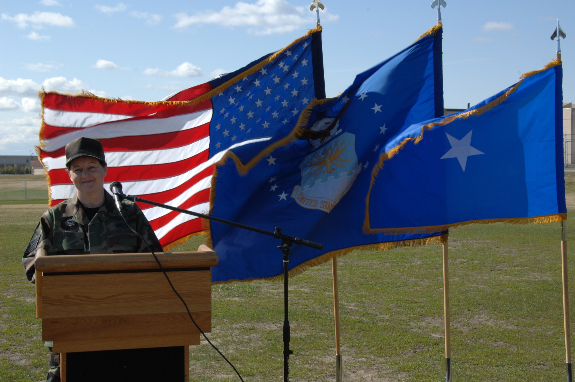 EIELSON AIR FORCE BASE, Alaska -- Assistant Fitness Director, 354 Services Squadron, Master Sgt. Susan Trejo speaks during the ground breaking ceremony, 354th Services Squadrons Baker Field House May 18 at the future location of the $24 million, 60,000 sq. ft. facility. The addition includes an indoor playing field allowing for intramural play of flag football and soccer, a 1/8 mile running track enabling year-round Air Force Fitness Management testing, and a weight-room. The facility addition will enhance opportunities to maintain and improve fitness training levels as well as accommodate recreational demands often hampered by Interior Alaskan winters extreme elements. The addition is scheduled to be complete by July 2008.  (U.S. Air Force photo by Staff Sgt. Tia Schroeder)