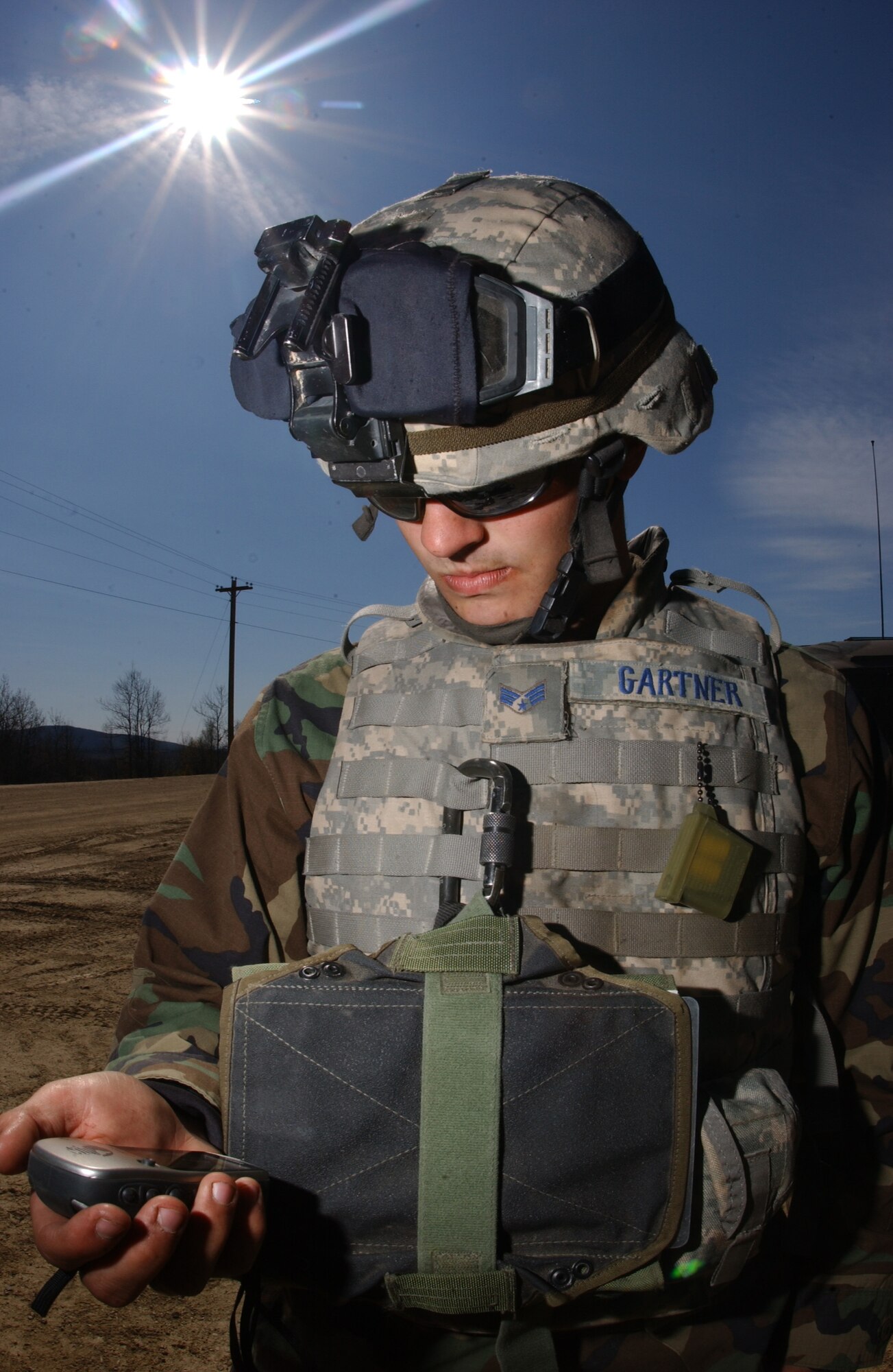 EIELSON AIR FORCE BASE, Alaska -- Senior Airman Benjamin Gartner, 3rd Air Support Operations Squadron tactical air control party, uses a Garmin Etrex Vista to enter in the waypoints to their destination during Operation URSA Minor May 17. The last scenario of the exercise 3rd ASOS Airmen must use their navigational skills to transport an air liaison officer to checkpoint two avoiding possible improvised explosive devices along the way. (U.S. Air Force Photo by Airman 1st Class Jonathan Snyder) 