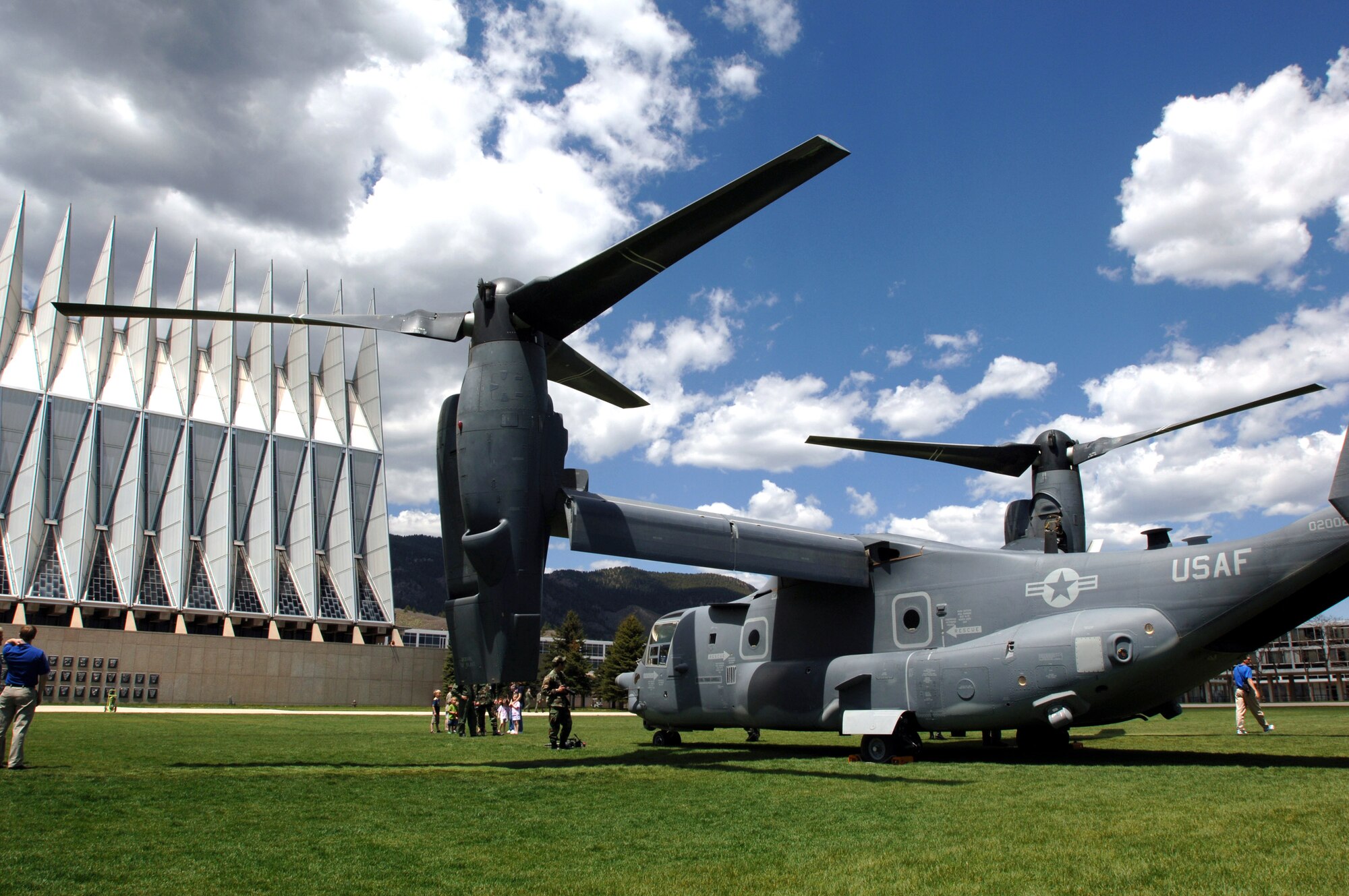 A CV-22 Osprey sits on display at the U.S. Air Force Academy May 11.  Cadets in the Department of Aeronautical Engineering's High-Performance Computing Research Center contributed to making this aircraft an operational reality through their research in computational fluid dynamics.  The famed Academy chapel is in the background.  (U.S. Air Force photo/Joel Strayer)