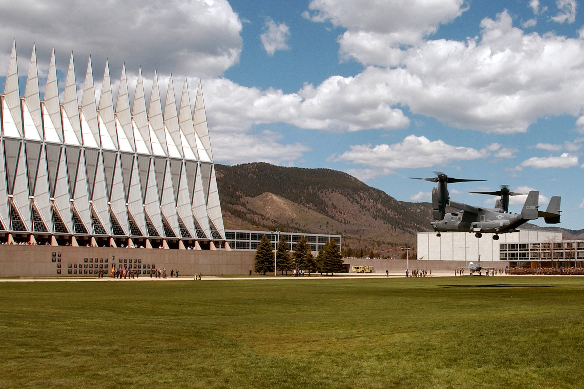 A CV-22 Osprey prepares to land at the U.S. Air Force Academy May 11.  Cadets in the Department of Aeronautical Engineering's High-Performance Computing Research Center contributed to making this aircraft an operational reality through their research in computational fluid dynamics.  The famed Academy chapel is in the background.  (U.S. Air Force photo/ Dennis Rogers)