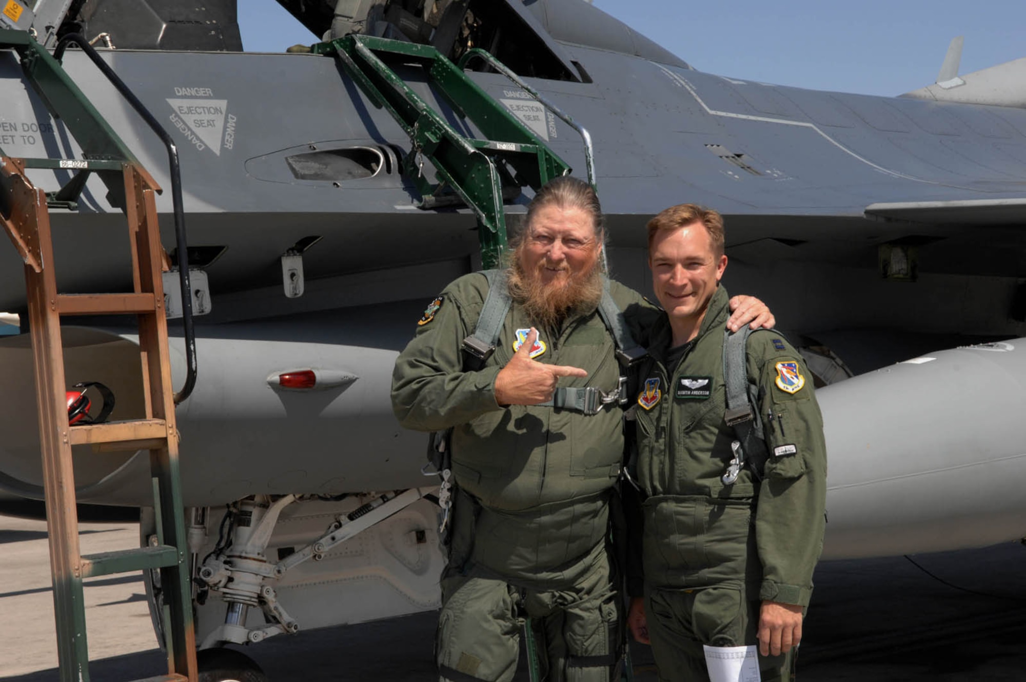 Capt. Quintin D. Anderson, F-16 fighter pilot, 422nd Test and Evaluation Squadron, and Mickey Jones, musician and actor, prepare for their flight in an F-16 May 17, 2007, Nellis AFB, Nev. Jones had a recurring role on the hit television show Home Improvement. (Air Force photo by Tech. Sgt. Pamela D. Smith)