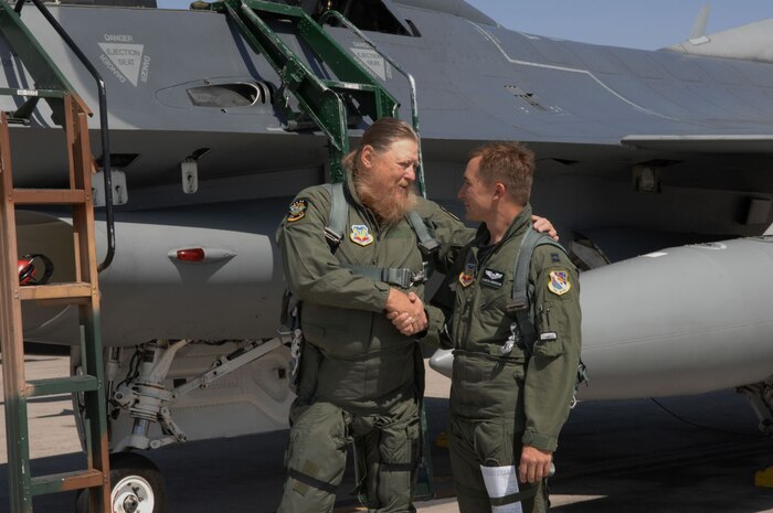 Mickey Jones, musician and actor, thanks Capt. Quintin D. Anderson, F-16 fighter pilot, 422nd Test and Evaluation Squadron, for his F-16 flight May 17, 2007, at Nellis AFB, Nev. Jones had a recurring role on the hit television show Home Improvement. (Air Force photo by Tech. Sgt. Pamela D. Smith)