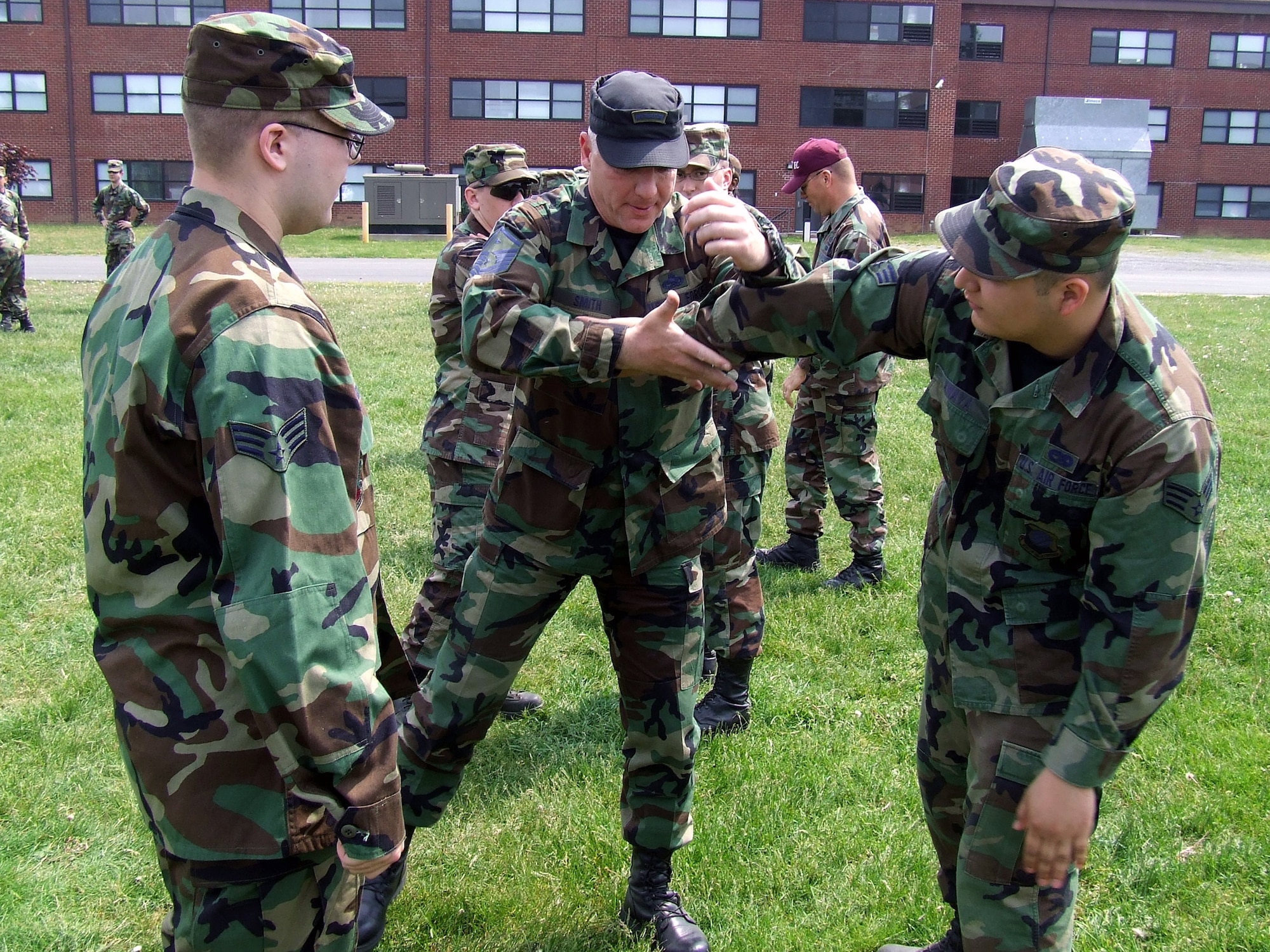 U.S. Air Force Master Sgt. Jack Smith, 421st Combat Training Squadron instructor, teaches students in the Advanced Contingency Skills Training Course 07-2C one of the moves in  Linear In-Fighting Neural Override Engagement, or LINE training, May 16, 2007, during a class session at the U.S. Air Force Expeditionary Center on Fort Dix, N.J.  LINE training is one of the newest training venues offered at the Center.  (U.S. Air Force Photo/Tech. Sgt. Scott T. Sturkol)
