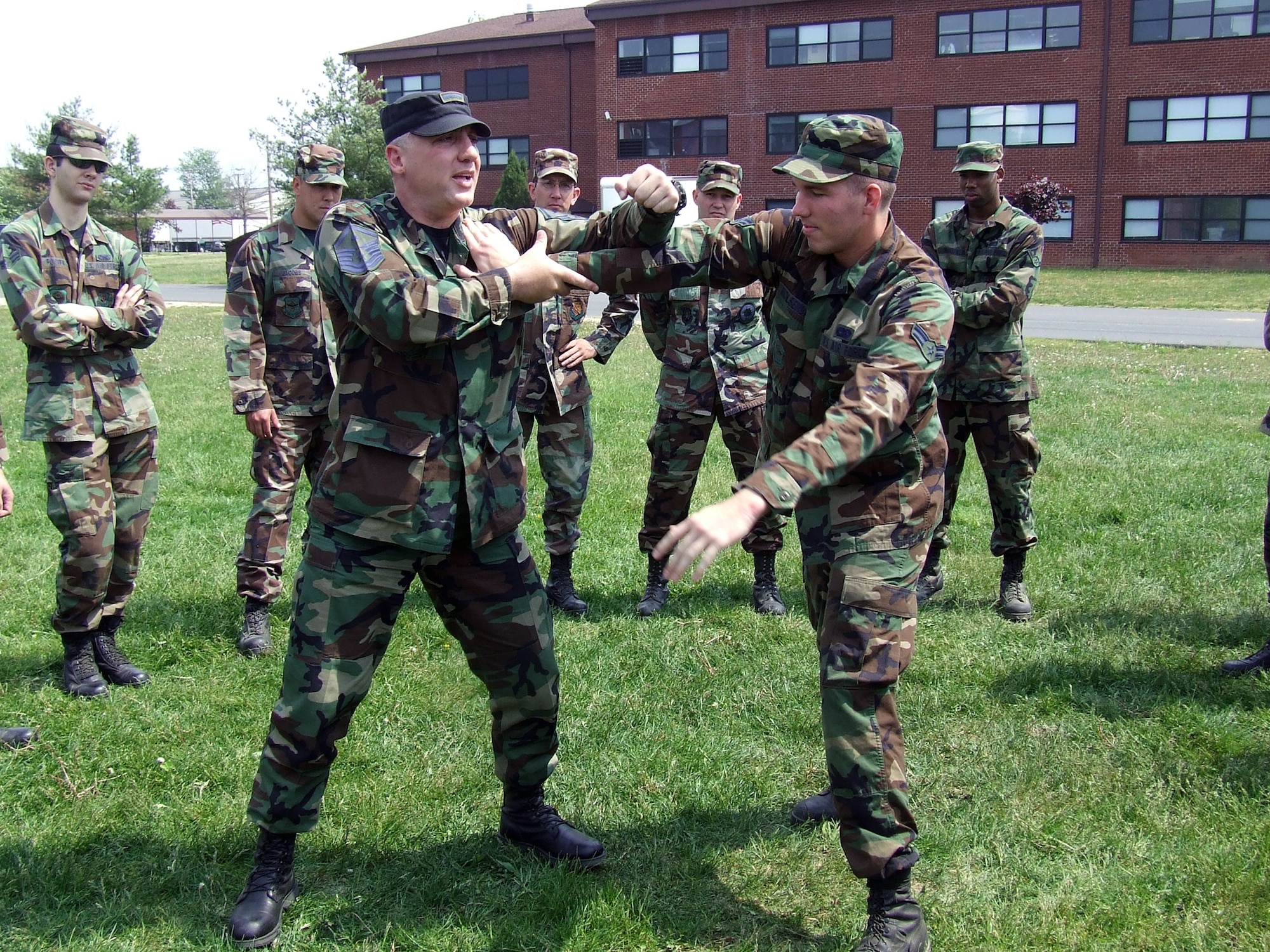 U.S. Air Force Master Sgt. Jack Smith, 421st Combat Training Squadron instructor, teaches students in the Advanced Contingency Skills Training Course 07-2C one of the moves in  Linear In-Fighting Neural Override Engagement, or LINE training, May 16, 2007, during a class session at the U.S. Air Force Expeditionary Center on Fort Dix, N.J.  LINE training is one of the newest training venues offered at the Center.  (U.S. Air Force Photo/Tech. Sgt. Scott T. Sturkol)
