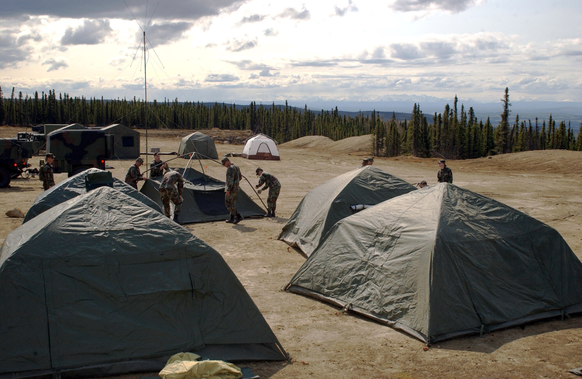 Airmen from the 3rd Air Support Operations Squadron at Eielson Air Force Base, Alaska, set up base camp in the Yukon training area May 15 during Operation Ursa Minor. The three-day field training exercise is designed to provide hands-on combat training and experience to Airmen before they deploy to a combat area. (U.S. Air Force photo/Airman 1st Class Jonathan Snyder)