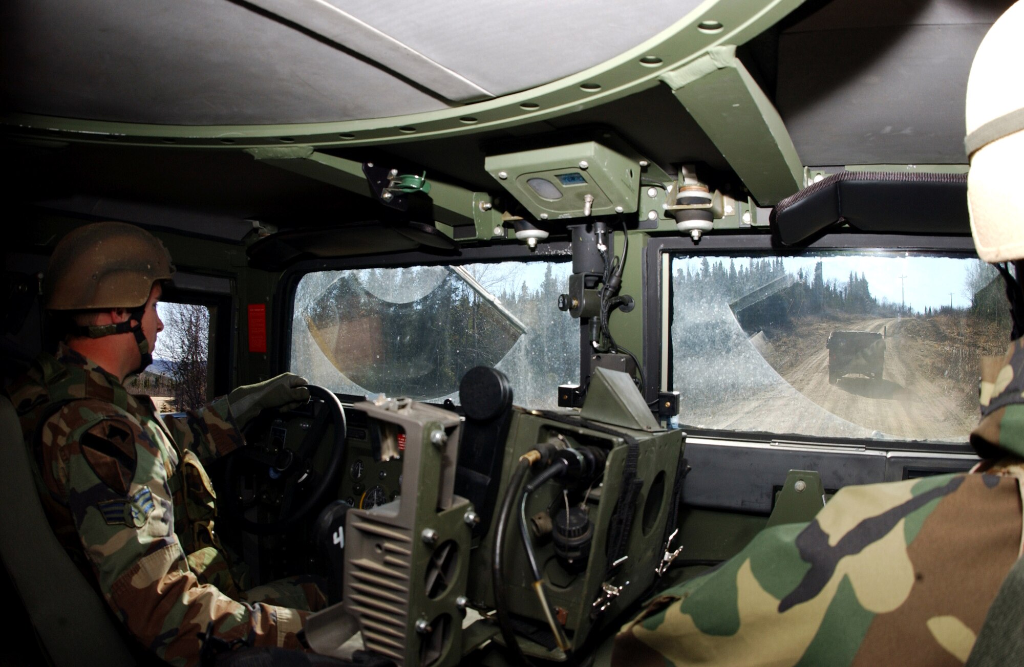 Senior Airman Robert Olson drives a Humvee during a vehicle navigation exercise May 16 at Eielson Air Force Base, Alaska.  The 3rd Air Support Operations Squadron tactical air control party Airman is participating in Operation Ursa Minor, a three-day field training exercise designed to provide hands-on combat training and experience to Airmen before they deploy to a combat area. (U.S. Air Force photo/Airman 1st Class Jonathan Snyder)