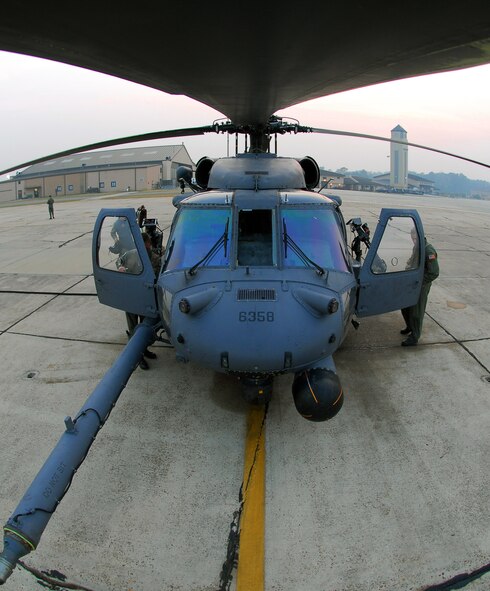 MOODY AIR FORCE BASE, Ga, --  Crew members with the 41st Rescue squadron here prepare a HH-60G Pave Hawk for a night rescue training mission May 15.  The HH-60G can be used for low-level rescue missions of forces in hostile territory through any weather conditions.  (U.S. Air Force photo by Tech. Sgt. Parker Gyokeres)
