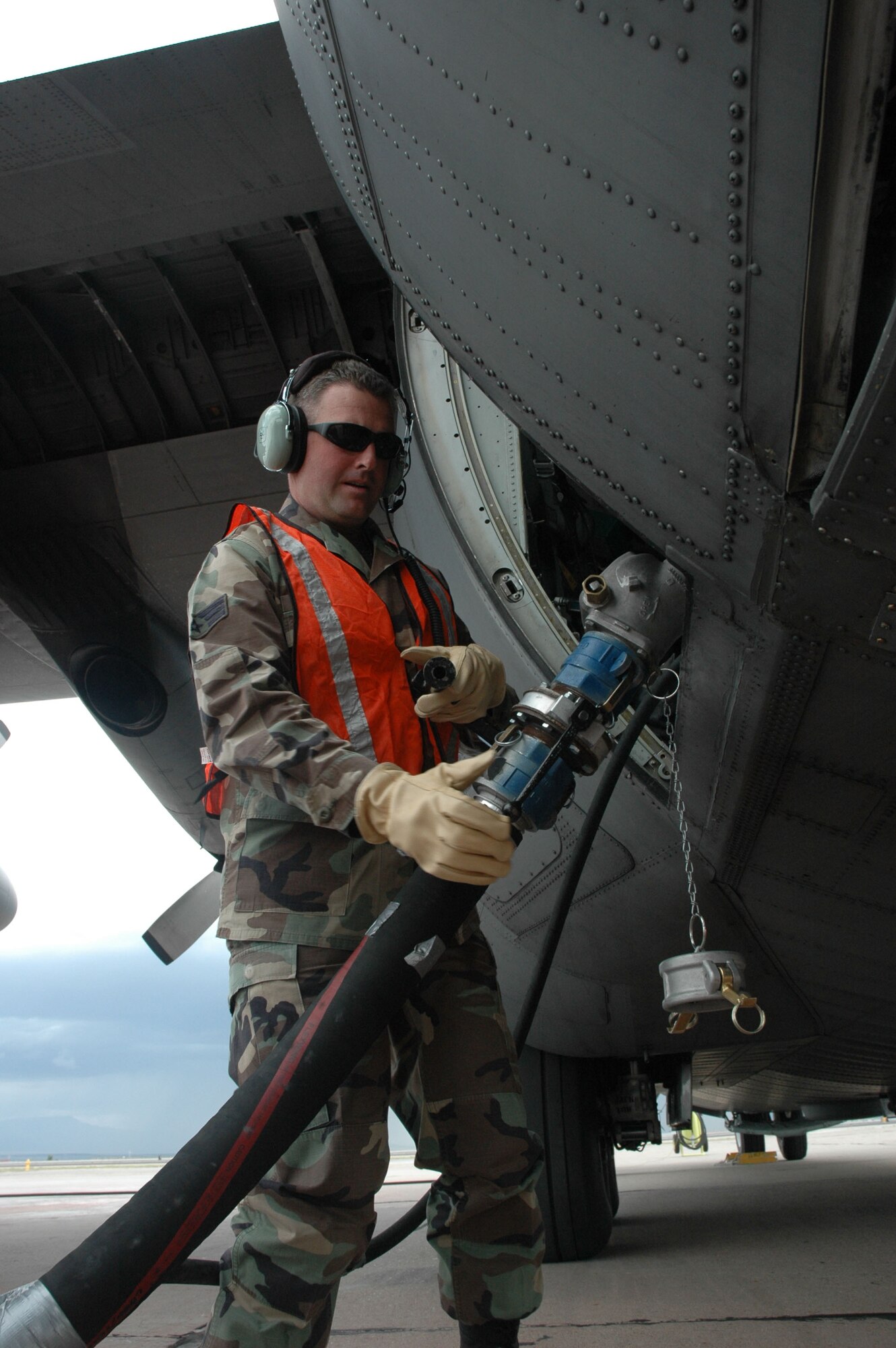 ALBUQUERQUE, N.M. (AFRC) -- Senior Airman Patrick J. Tasca, 302nd Maintenance Squadron integrated avionics system technician, attaches a water hose to a Modular Airborne Fire Fighting System. (U.S. Air Force photo by Tech. Sgt. Tim Taylor)