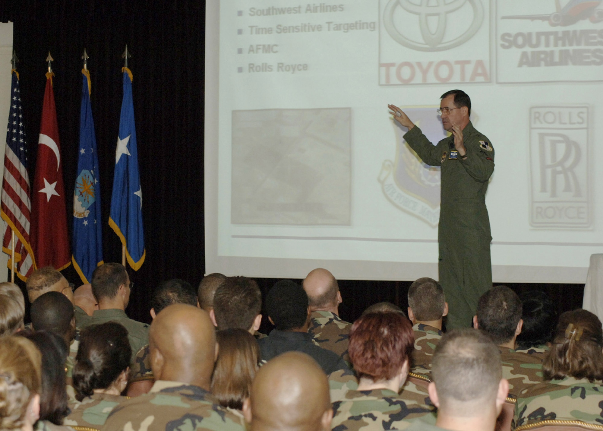 Senior leaders sit in on a brief given by Maj. Gen. Marc Rogers, U.S. Air Forces in Europe vice commander, May 11 at Incirlik Air Base, Turkey. General Rogers discussed the importance of Air Force Smart Operations for the 21st Century, more commonly referred to as AFSO21. The "lean process" is the endless pursuit of identification and elimination of waste, adapting to change, and continuous process improvement. (U.S. Air Force photo/1st Lt. Rose Richeson)
