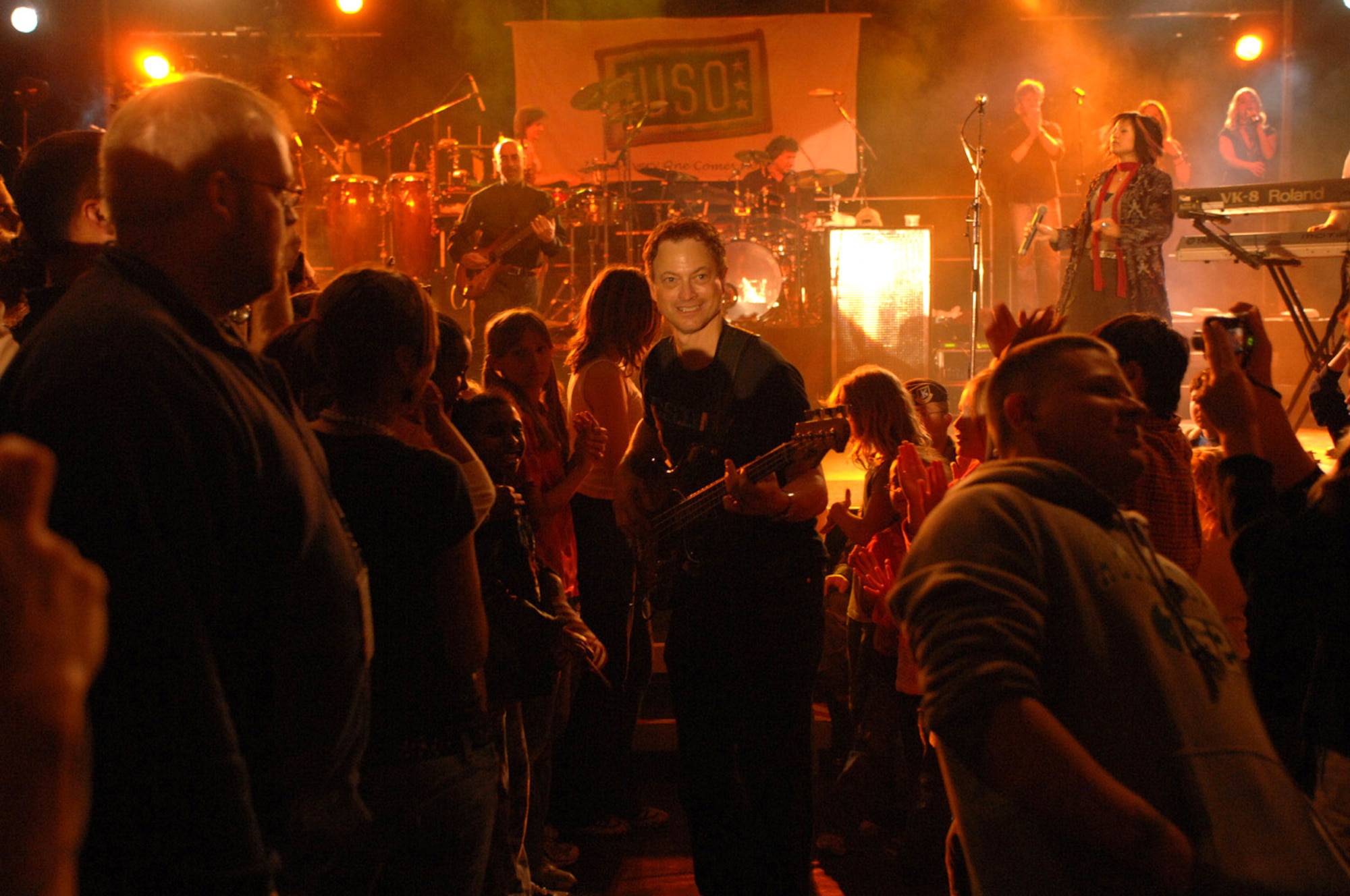 Gary Sinise enters the crowd as the Lt. Dan Band performs at Spangdahlem Air Base, Germany, May 15 to a crowd of more than 650 attendees. The band is just wrapping up its 2007 European tour. They played five United Service Organization, or USO, shows throughout Belgium and Germany. (U.S. Air Force photo/Airman 1st Class Stephanie Clark)
