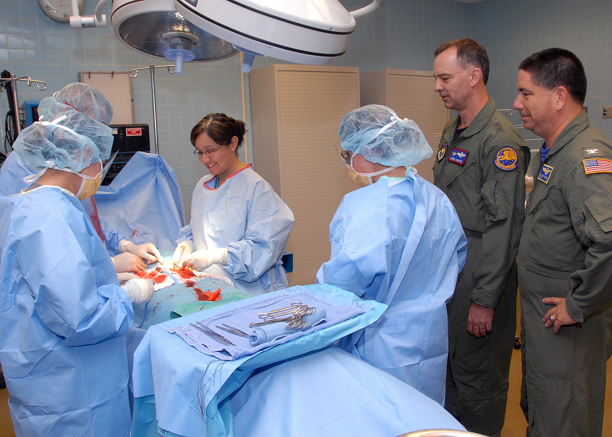Maj. Gen. Mark Zamzow, Air Education and Training Command air, space and information operations director, watches Airmen-in-Training in a simulated operating room during the general's visit May 14. (U.S. Air Force photo/Mike Litteken)