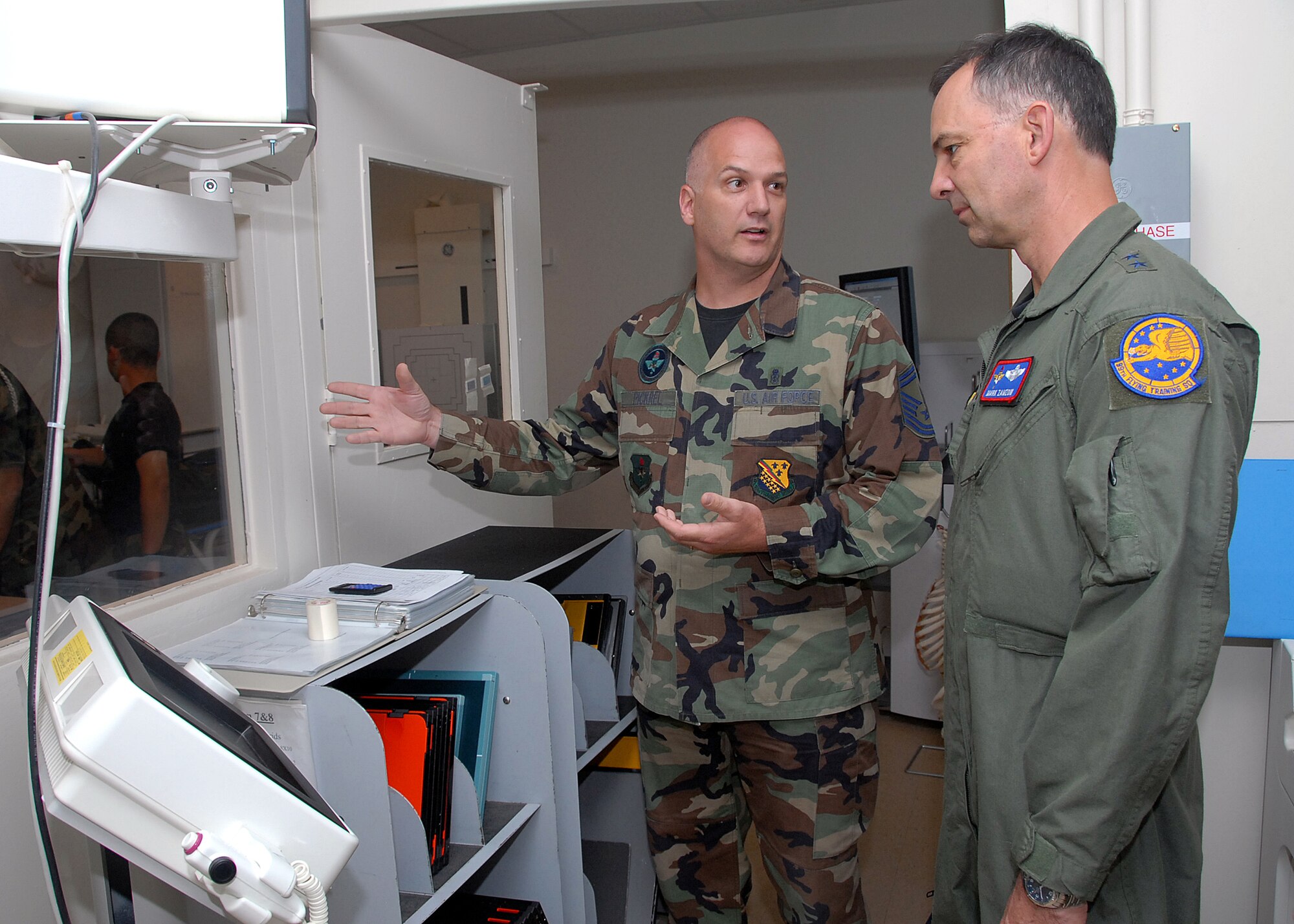 Senior Master Sgt. David Pickrel, 382nd Training Squadron, explains the diagnostic imaging course to Maj. Gen. Mark Zamzow, Air Education and Training Command air, space and information operations director, during the general's visit May 14. (U.S. Air Force photo/Mike Litteken)