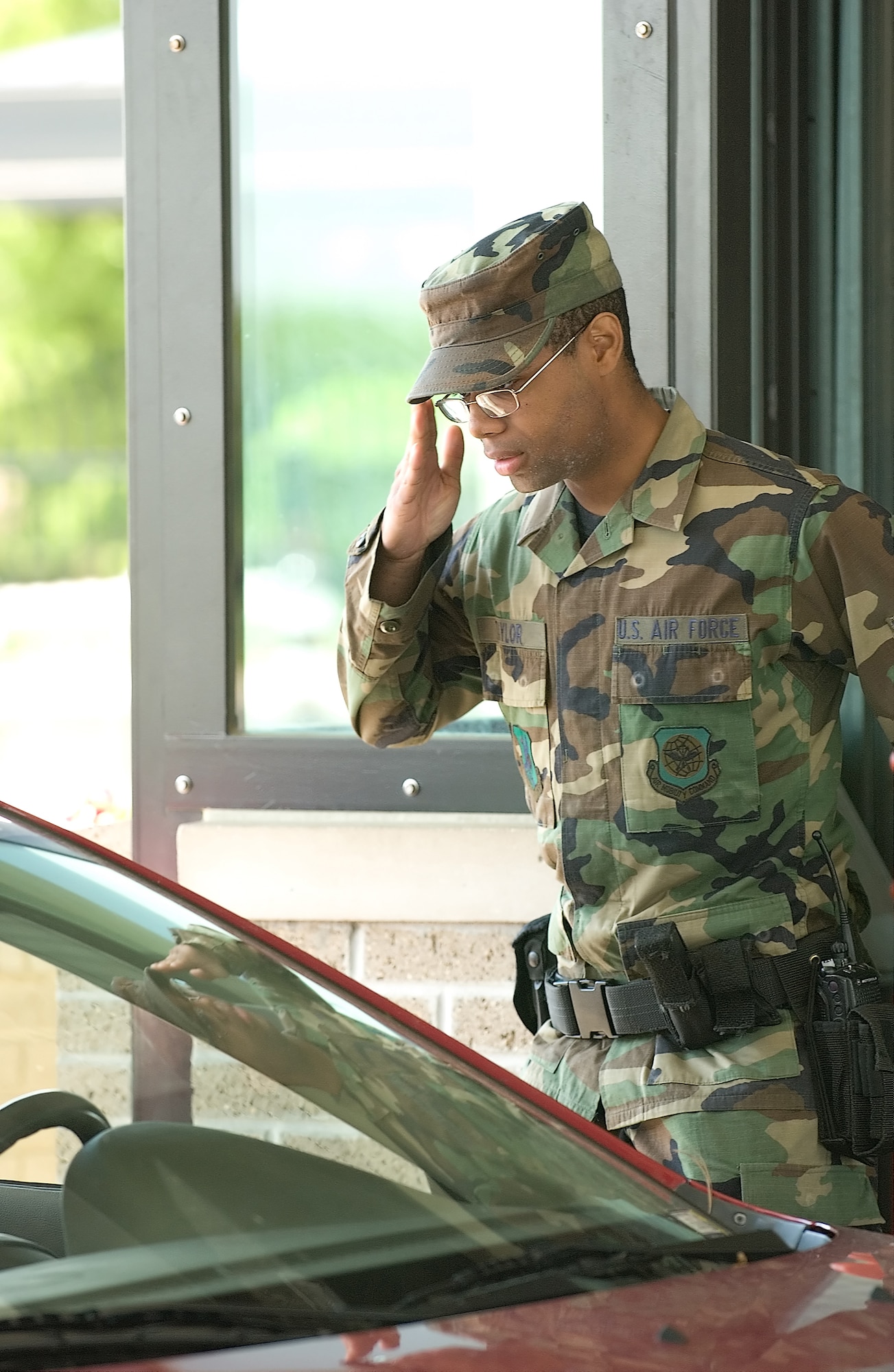 DOVER AIR FORCE BASE, Del. -- Airman 1st Class Jonathan Taylor, 436th Security Forces Squadron augmentee, salutes an officer as he passes through Dover's Main Gate Monday. Airman Taylor is an Air National Guard member on orders to Dover. (U.S. Air Force photo/Jason Minto)